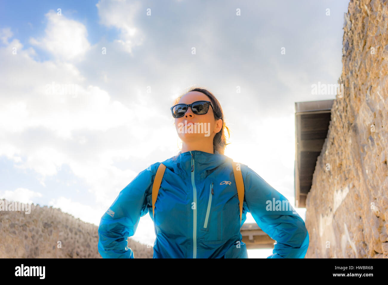 A woman examines the ruins of Pompeii Stock Photo