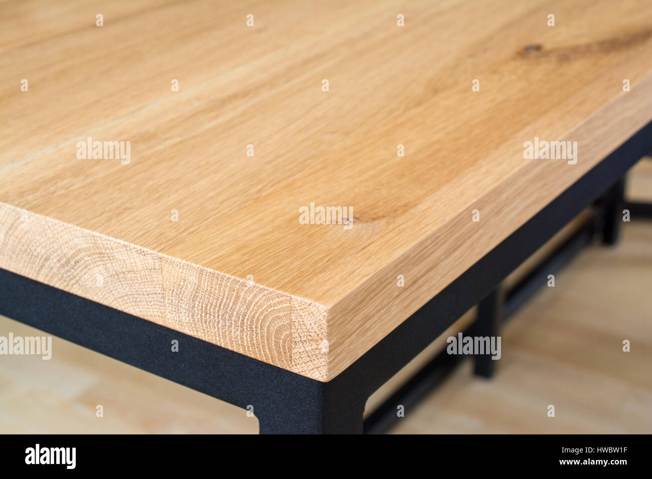 Edge and corner of wooden table top made of oak wood. Table top on ...