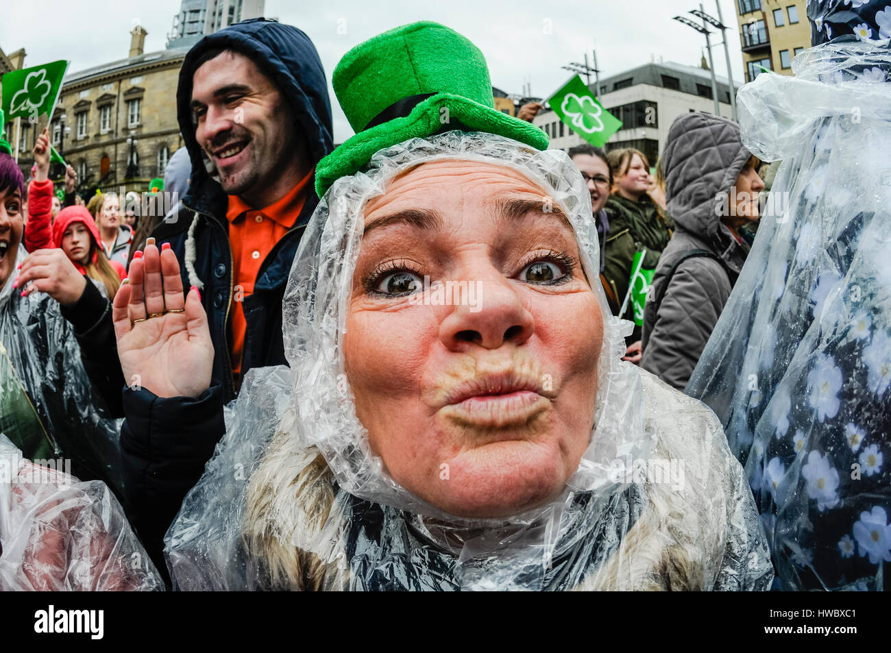 Belfast, Northern Ireland. 17 Mar 2016 - A woman puckers up for a kiss while wearing a green Leprachaun hat, as people in Belfast celebrate Saint Patrick's Day. Stock Photo