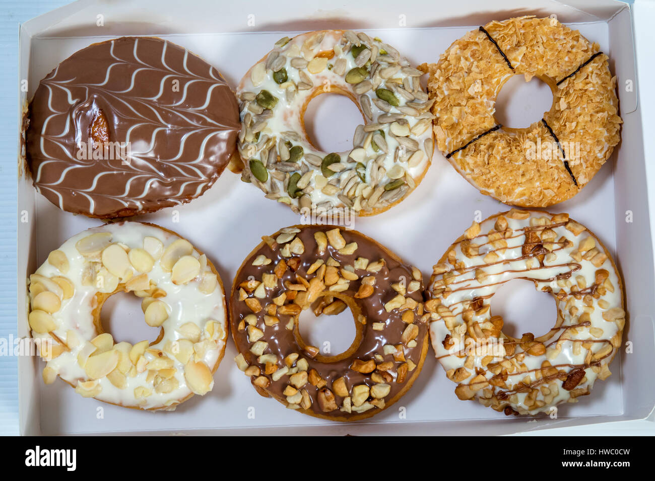 Delicious Donuts in a Box in isolated White Background Stock Photo - Alamy