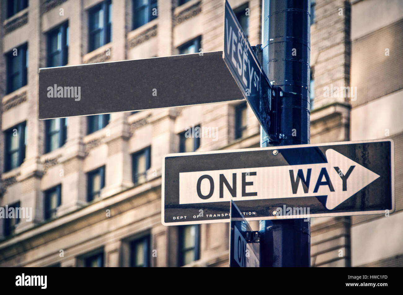 Blank sign and one way roadsign in New York City, USA Stock Photo
