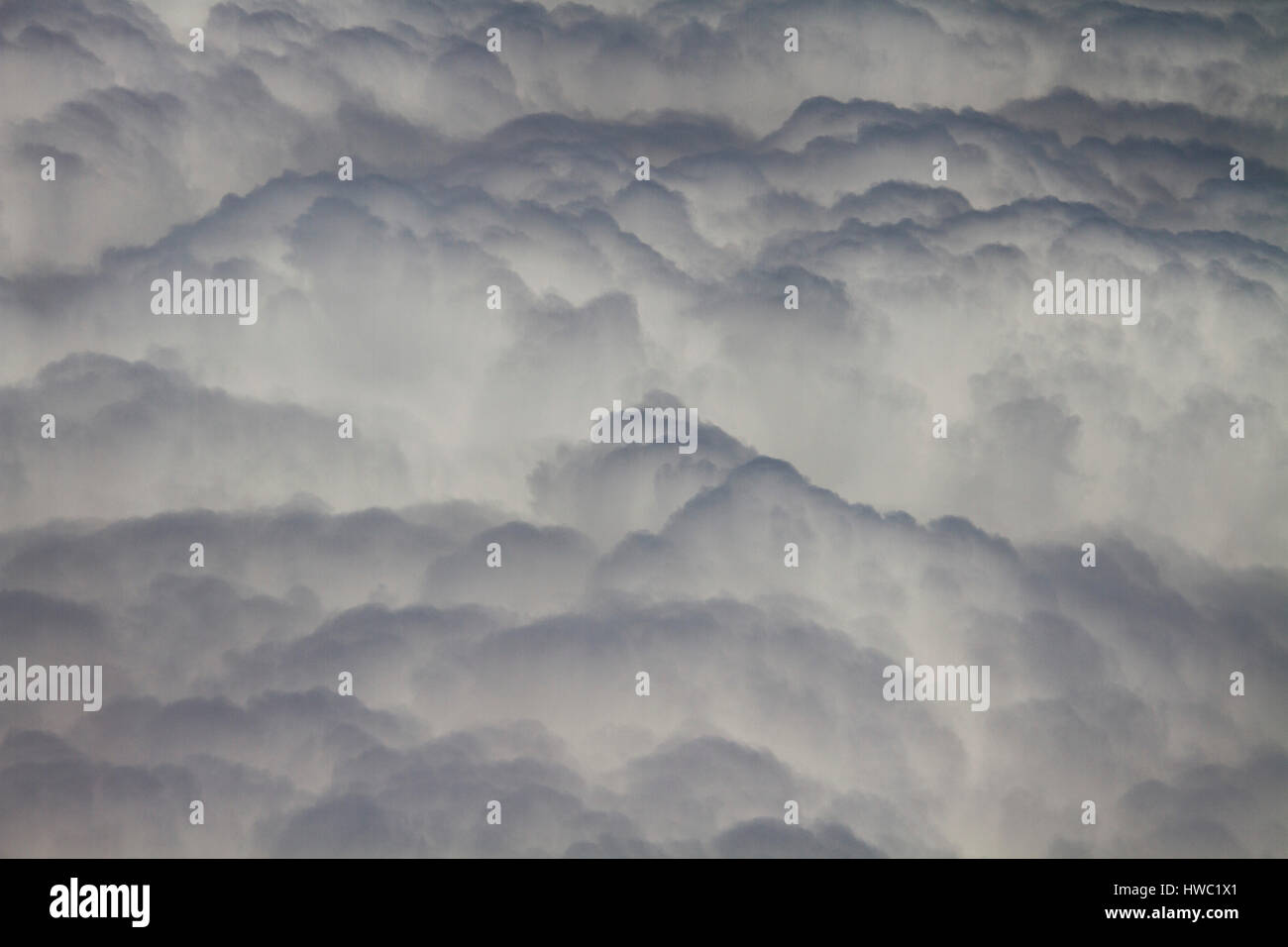 View above fluffy clouds at high altitude China Stock Photo