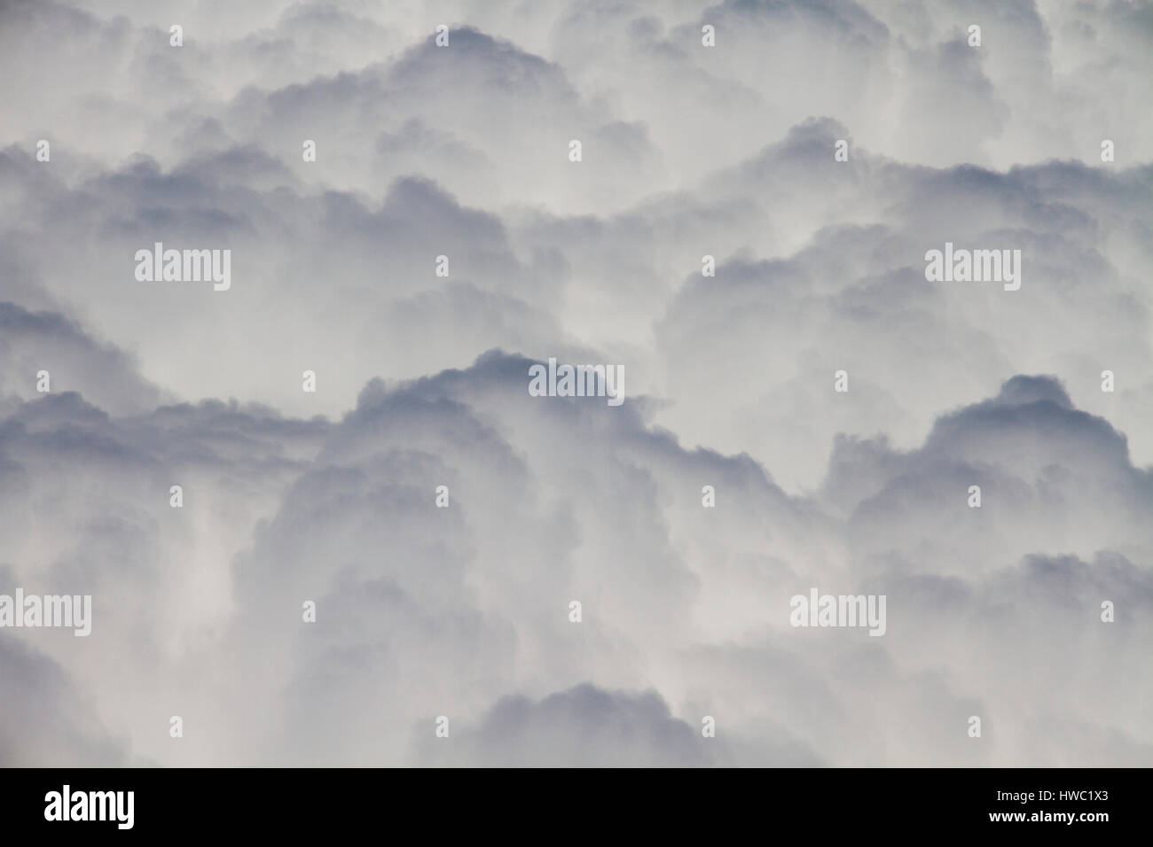 View above fluffy clouds at high altitude China Stock Photo