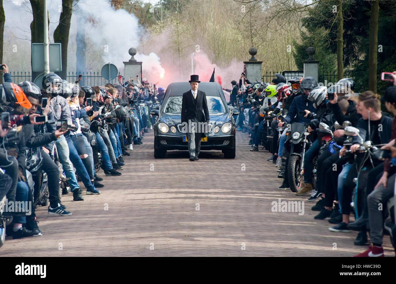 Members of a motor gang making a lane during a funeral procession. It is a tribute because one of their members was perished in a crash. Stock Photo