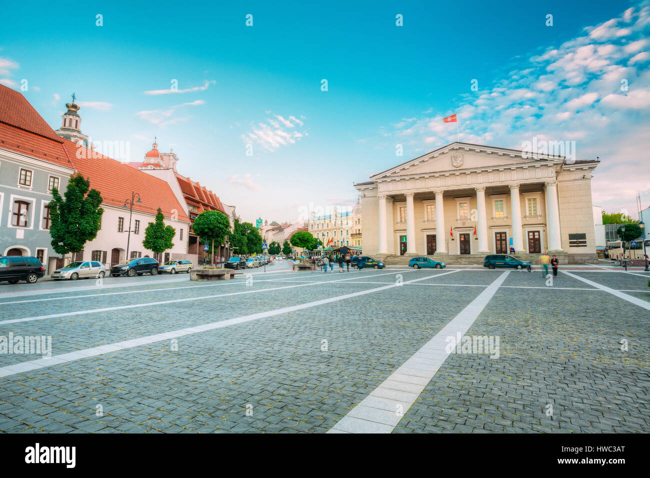Vilnius, Lithuania. The View Of Main Facade Of Town Council, Administrative Building With Columns On Didzioji Street In Old Town In Summer Day Under B Stock Photo