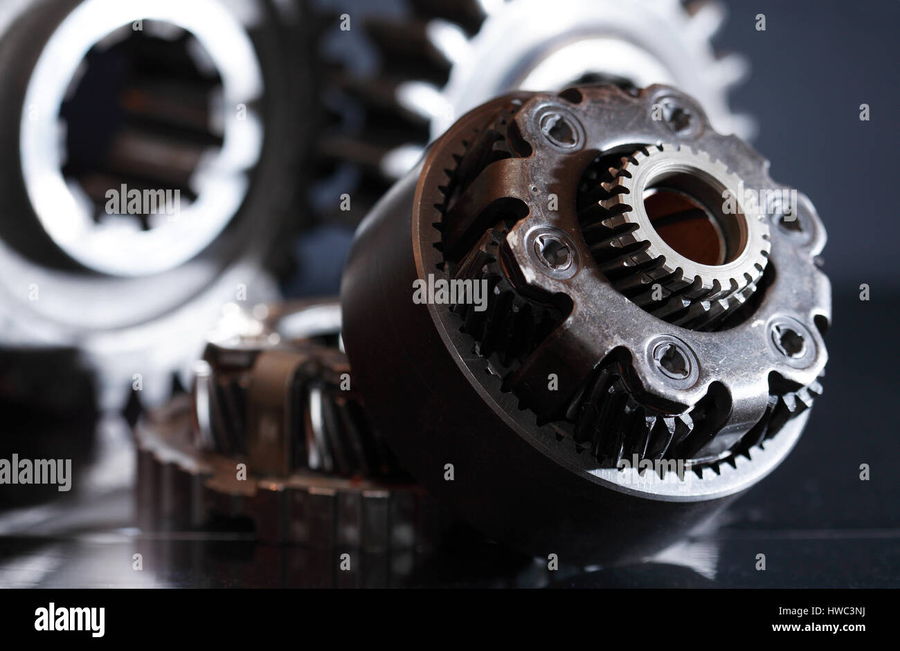 Machinery concept. Set of various gears closeup on dark background Stock Photo