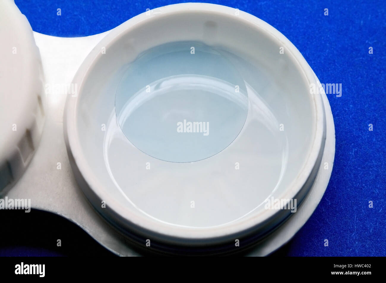 The contact lens stored a special solution for clearing Stock Photo