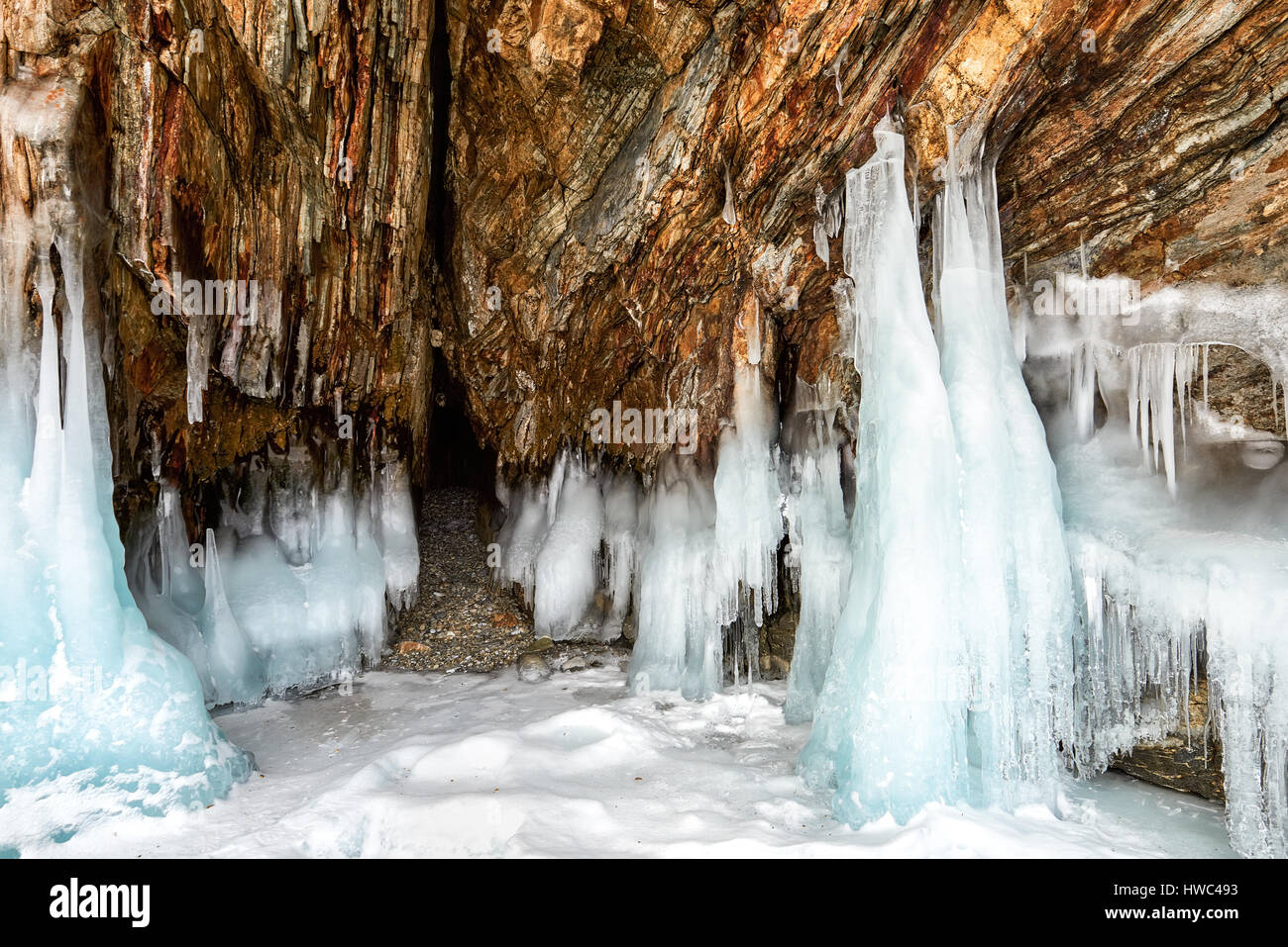 Narrow grotto and splash of ice on rock. Lake Baikal. Northern part of island of Olkhon. Russia Stock Photo