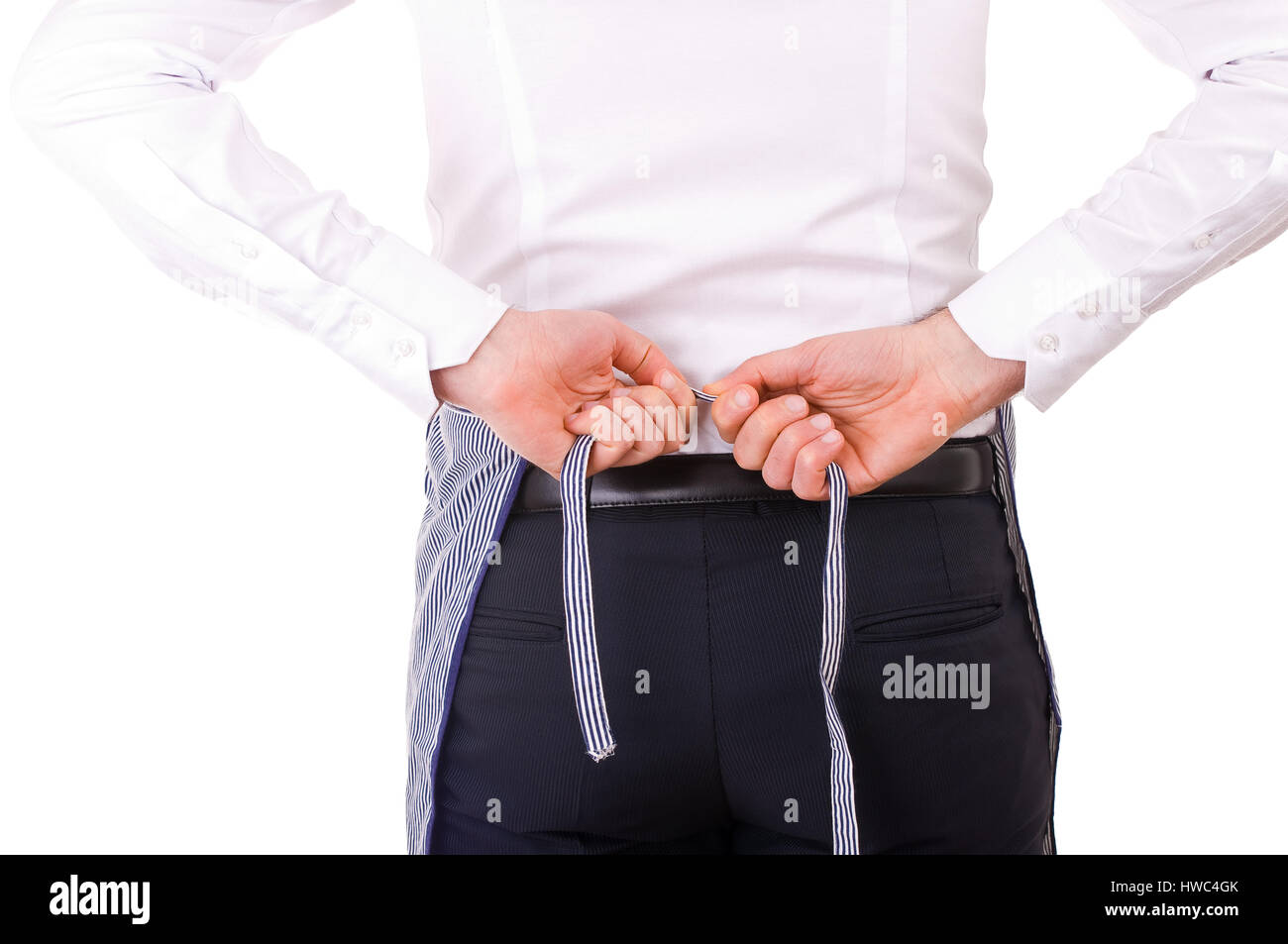 Businessman tying apron strings Stock Photo Alamy
