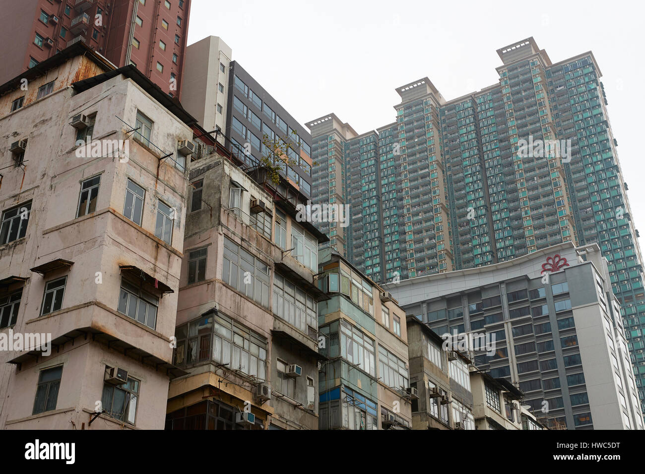 Contrasting Up-Market And Low Rent Buildings In Kowloon City, Hong Kong. Stock Photo