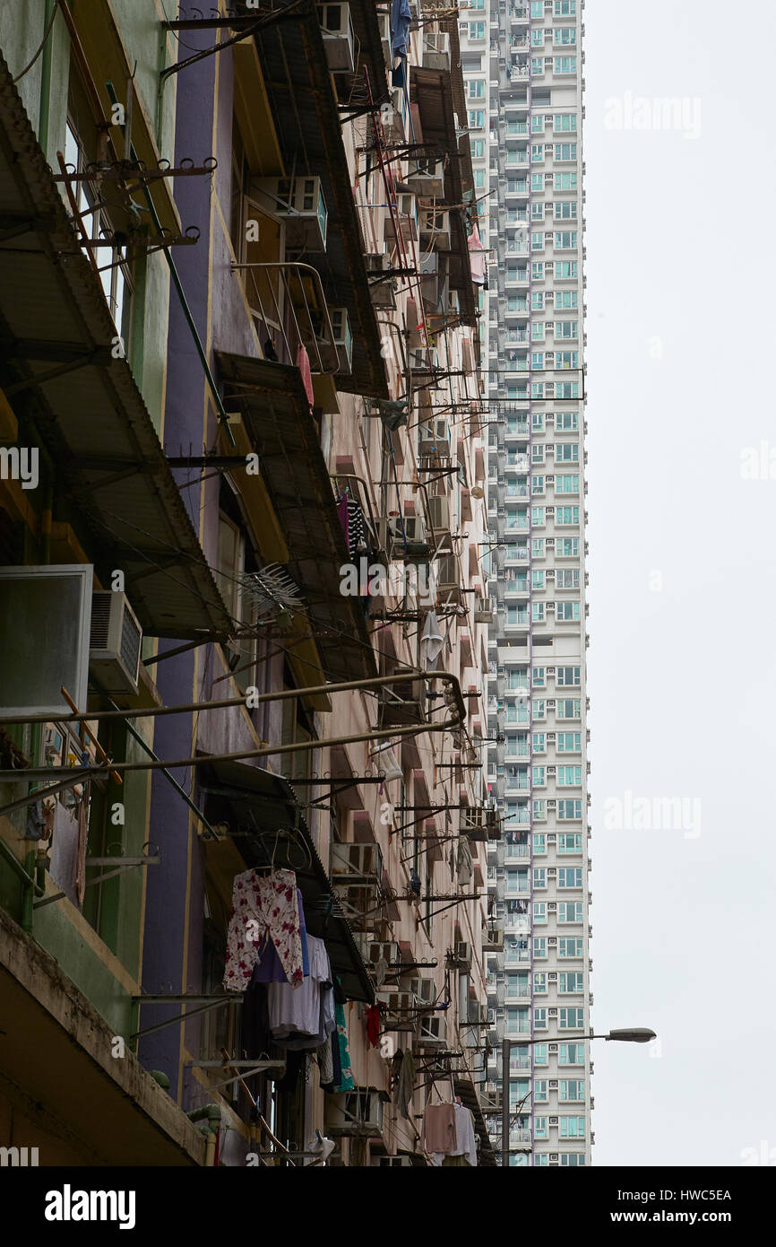 Contrasting Up-Market And Down-Market Buildings In Kowloon City, Hong Kong. Stock Photo