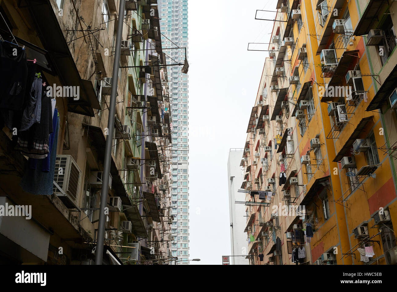 Contrasting High Rise And Low Rent Buildings In Kowloon City, Hong Kong. Stock Photo