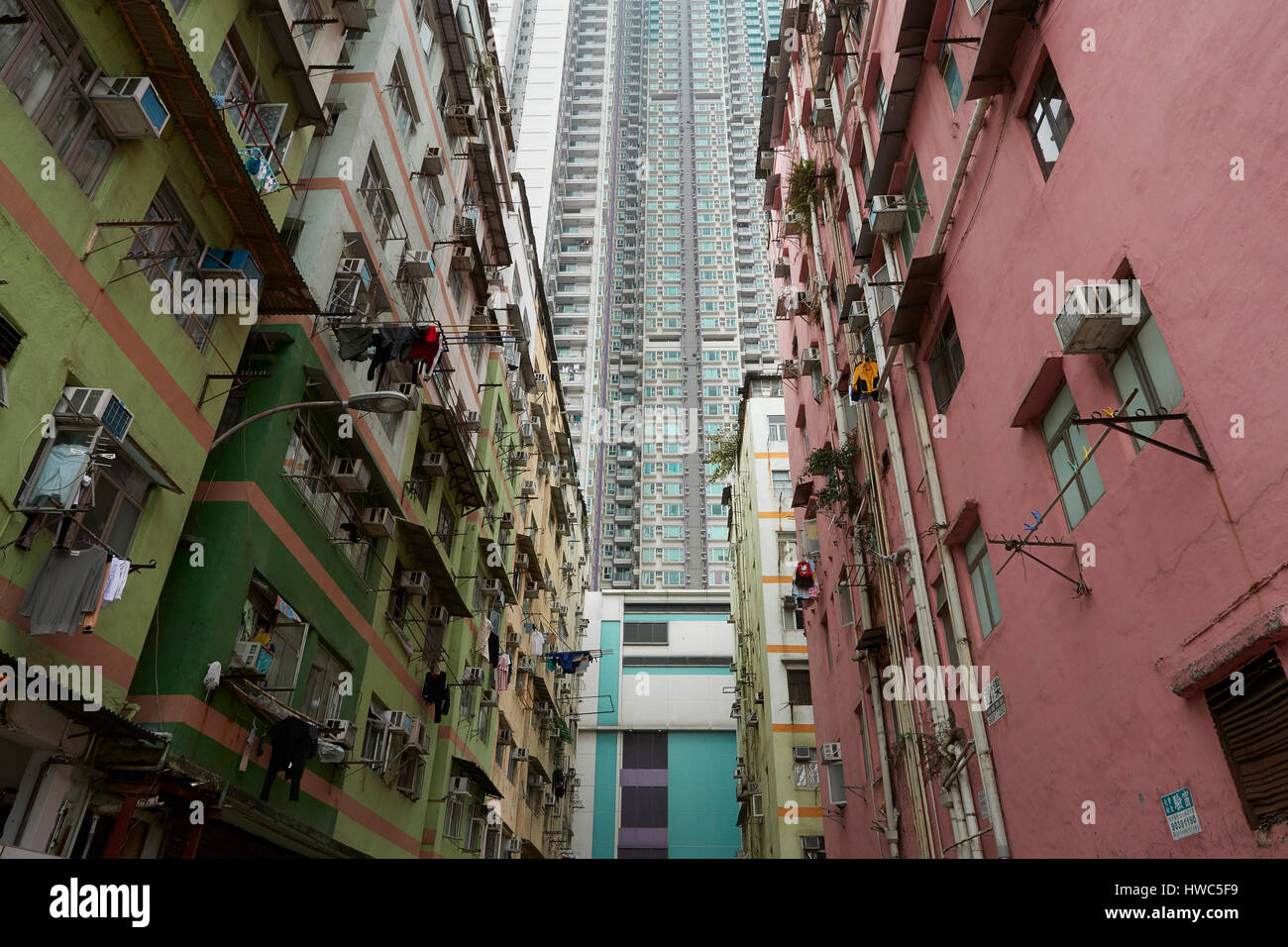 Contrasting High Rise And Low Rise Buildings In Kowloon City, Hong Kong. Stock Photo
