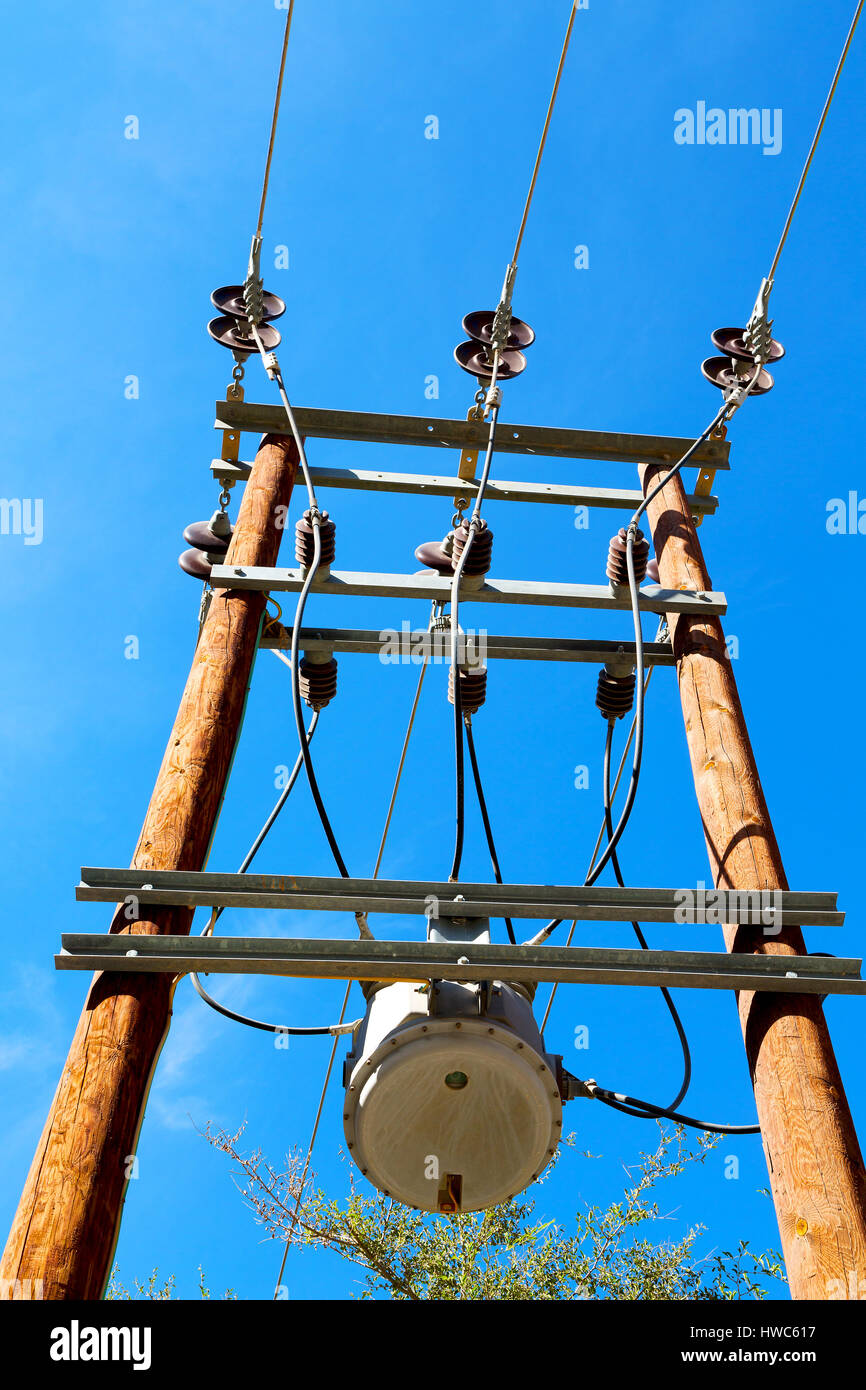 wood pylon energy and current line in oman the electric cable Stock