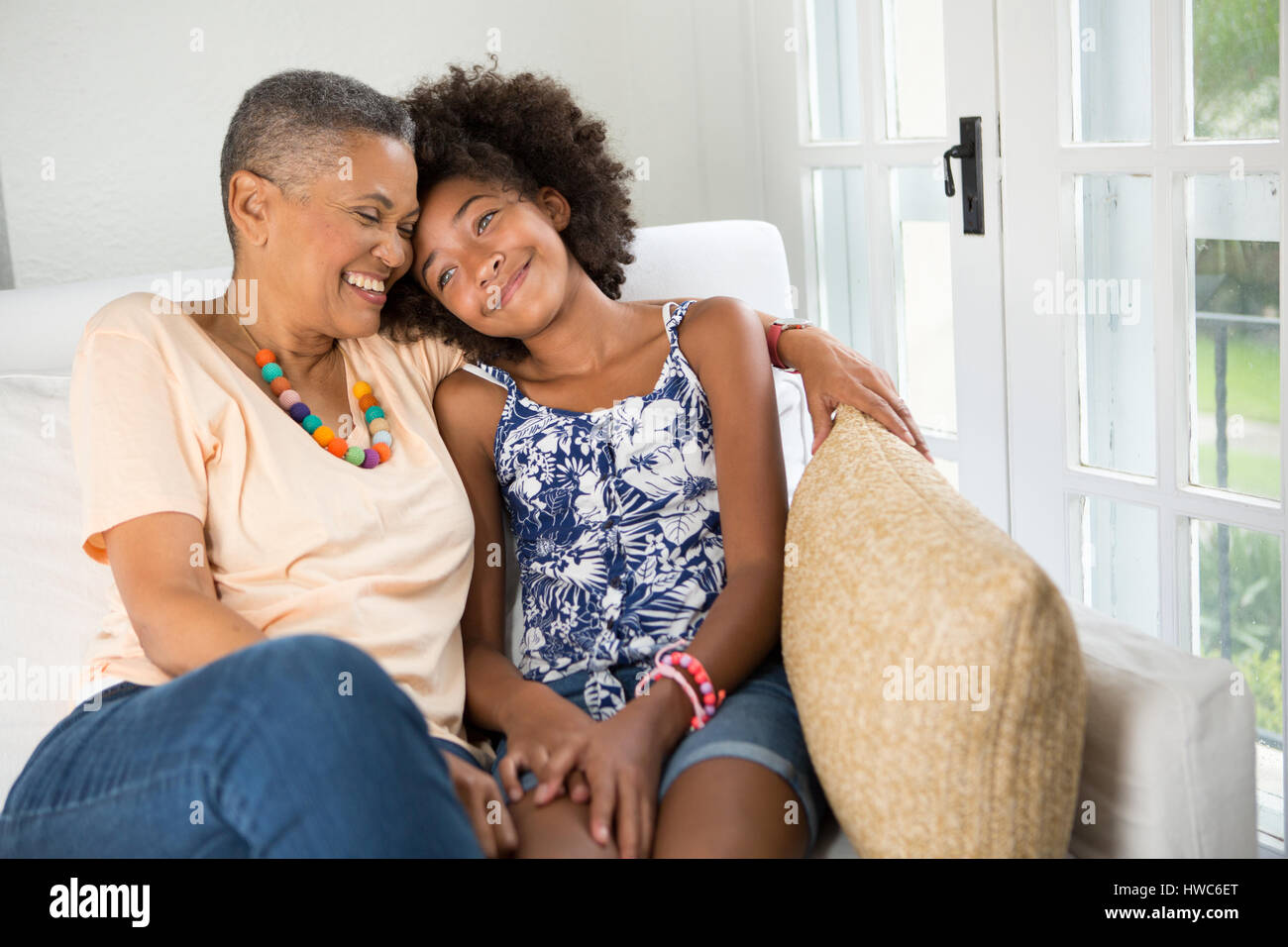 Girl spends quality time with her grandmother Stock Photo