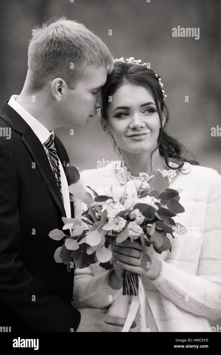 Wedding fashionable beautiful photo. Wedding portrait. Wedding attractive gorgeous bride. Wedding beautiful couple. Weddingbouquet of flowers. Wedding Stock Photo
