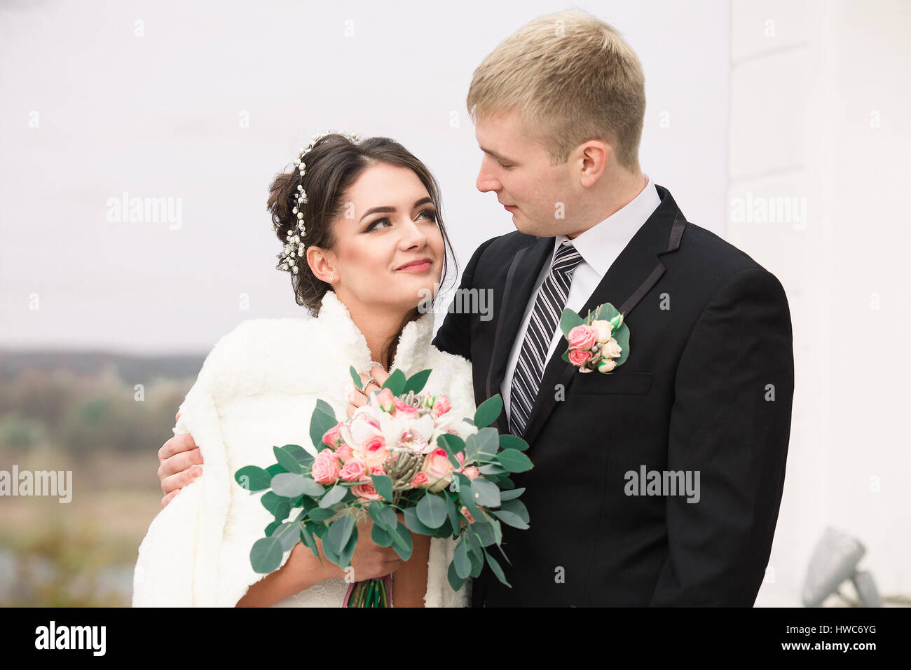 Wedding fashionable beautiful photo. Wedding portrait. Wedding attractive gorgeous bride. Wedding beautiful couple. Weddingbouquet of flowers. Wedding Stock Photo