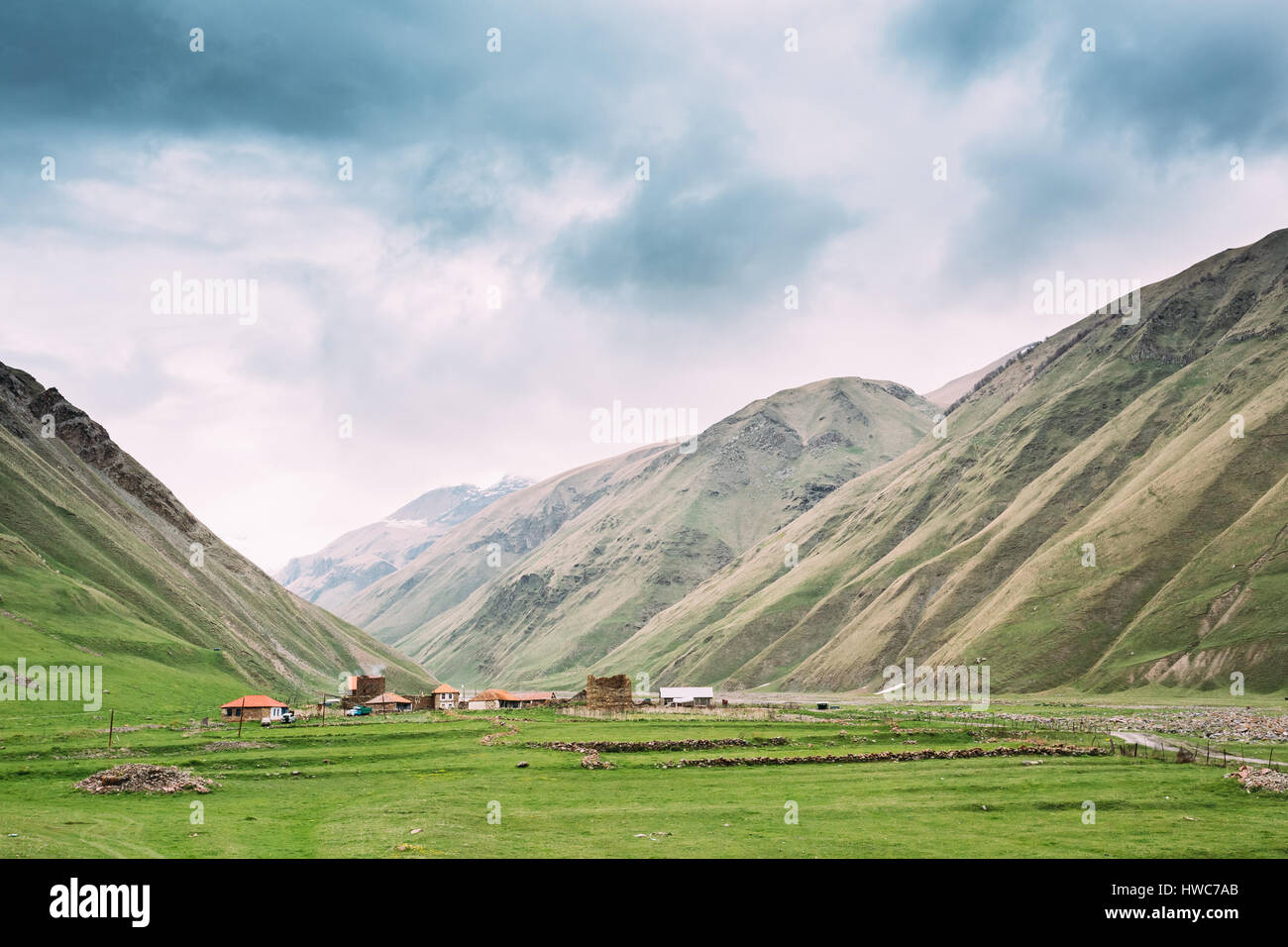 Old Empty Abandoned Village With Dilapidated Houses In Truso Gorge, Kazbegi District, Mtskheta-Mtianeti Region, Georgia. Spring Or Summer Season Stock Photo