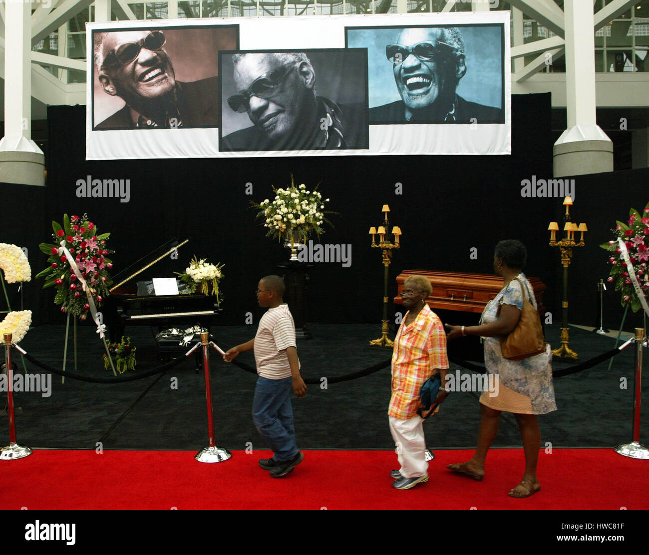 Mourners pass the coffin of singer Ray Charles at the Los Angeles  Convention Center on Thursday, 17 June 2004 in Los Angeles, California. The  funeral for Charles, who died Thursday June 10,
