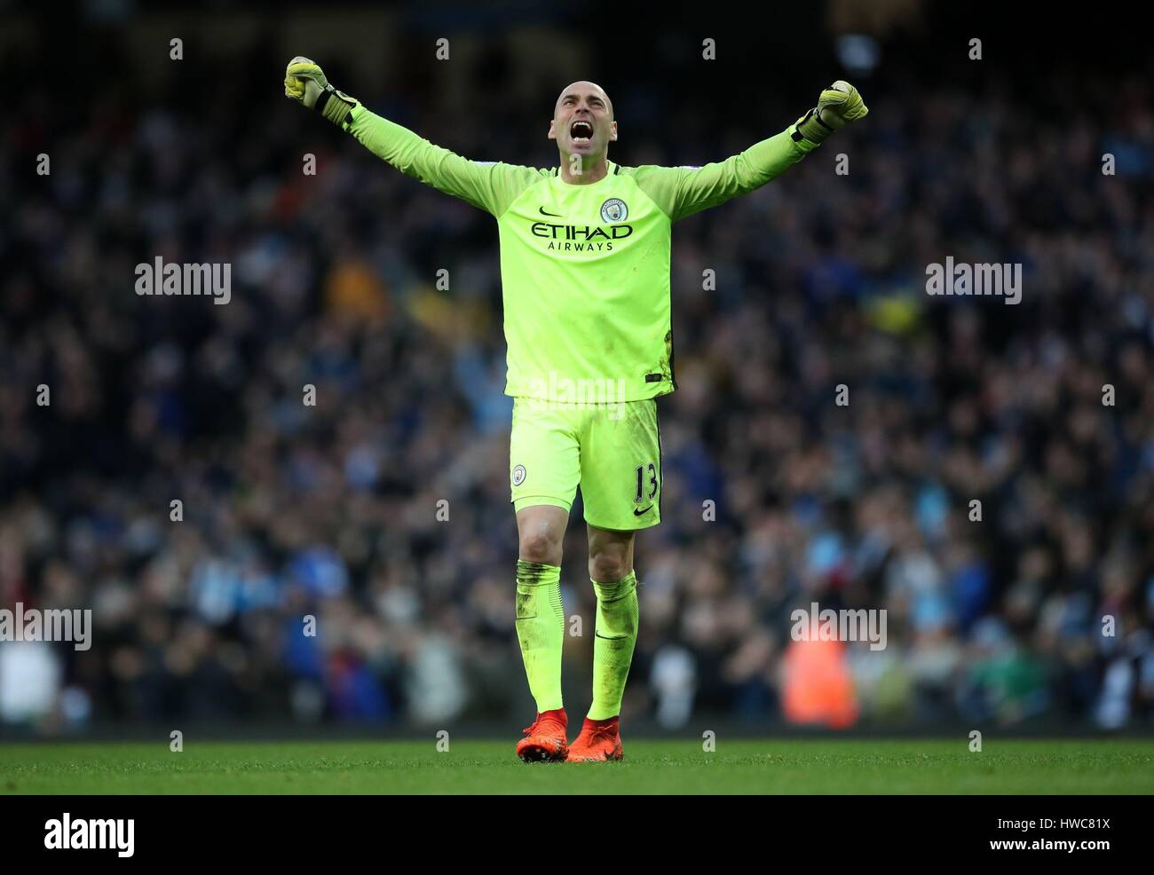 Manchester City goalkeeper Willy Caballero celebrates after Sergio Aguero scores his sides first goal of the game during the Premier League match at the Etihad Stadium, Manchester. Stock Photo
