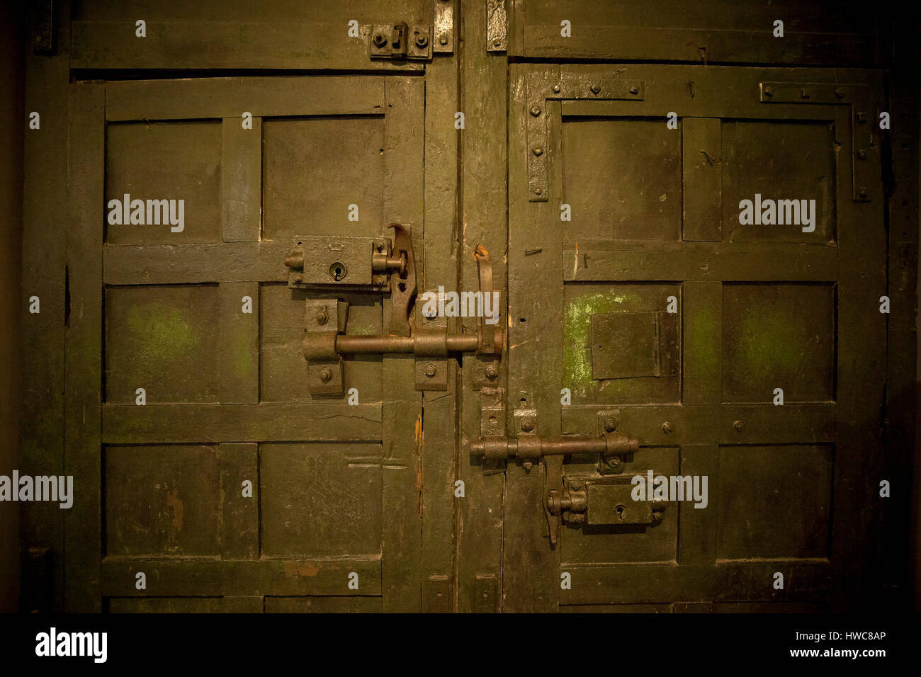 Prison door with bolts, locks. Hoa Lo Prison, Hanoi, Vietnam Stock Photo