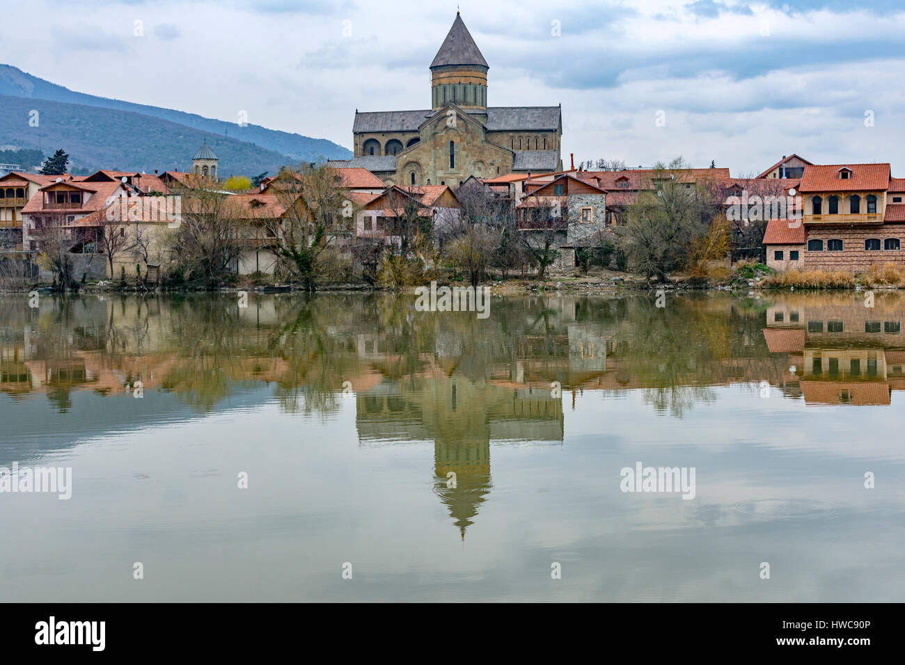 View of Svetitskhoveli cathedral over Mtkvari (Kura) river at early springtime Stock Photo