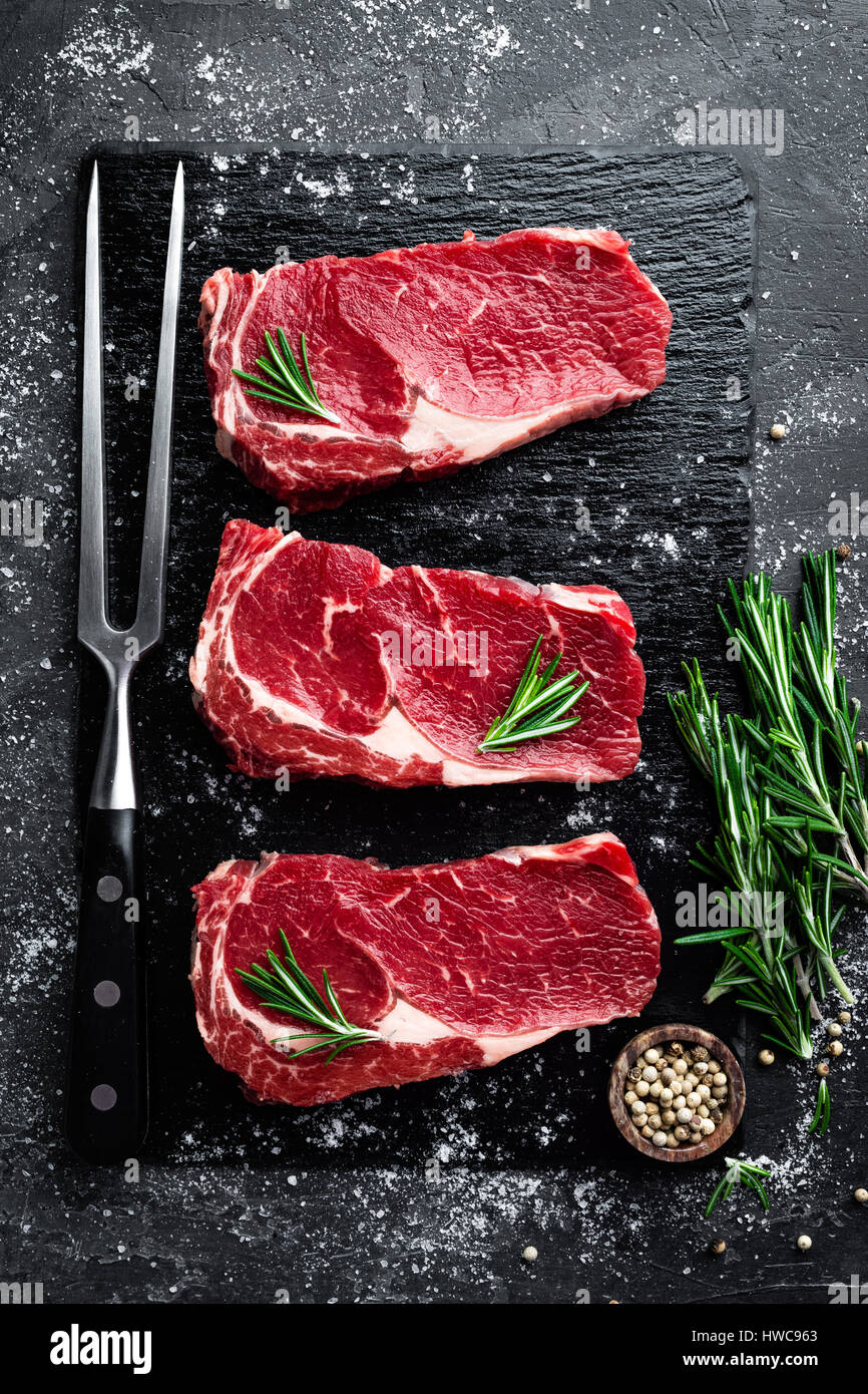 Raw meat, beef steak on black background, top view Stock Photo Alamy