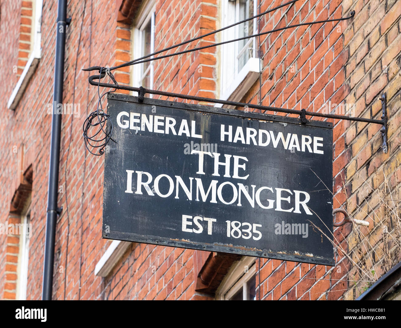 Old Ironmonger's sign on a shop in London's Seven Dials area, near Covent Garden and Soho Stock Photo