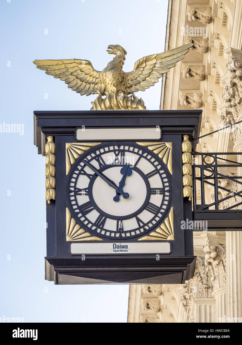 Clock outside the Daiwa Capital Markets investment bank in King William Street in London's Square Mile Financial District Stock Photo