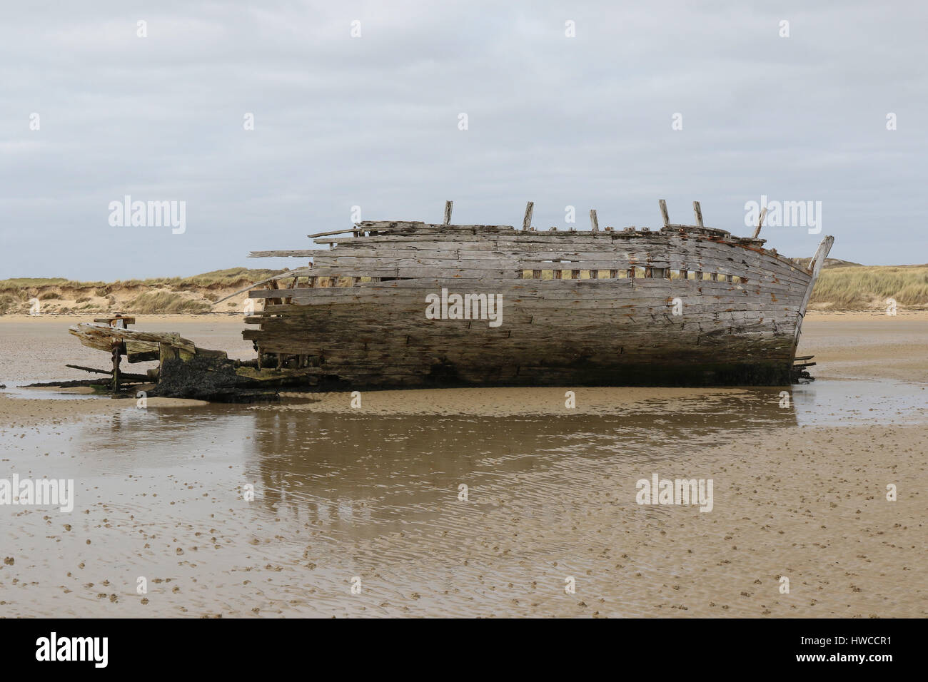 The wreck of a wooden fishing boat at Bunbeg, County Donegal, Ireland. The wreck is known as Bad Eddie's (fishing boat). Stock Photo