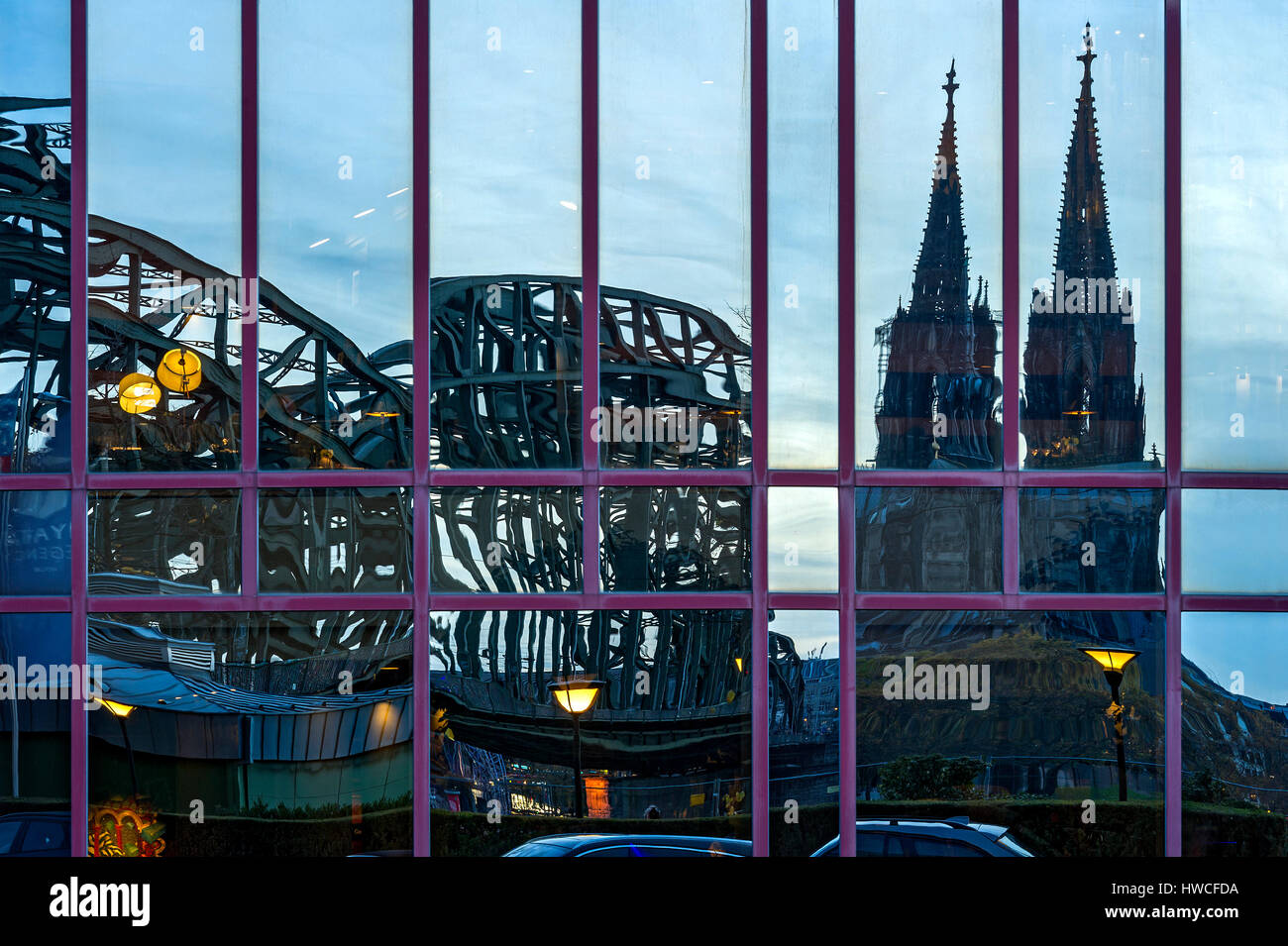 Reflection in glass facade of the Hyatt Regency Hotel, Hohenzollern Bridge, Cologne Cathedral, Cologne, North Rhine-Westphalia Stock Photo