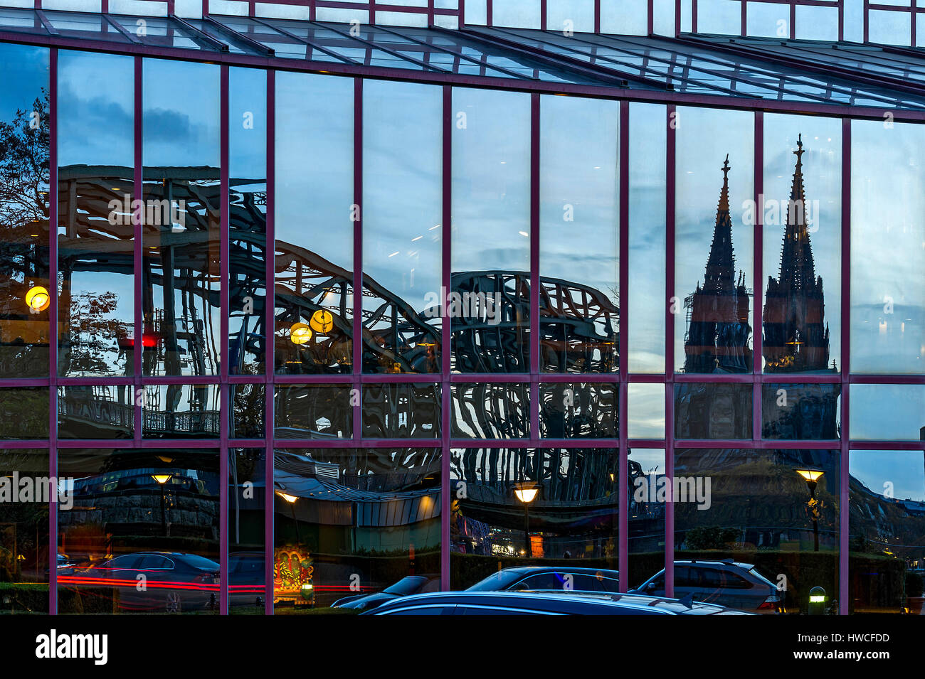 Reflection in glass facade of the Hyatt Regency Hotel, Hohenzollern Bridge, Cologne Cathedral, Cologne, North Rhine-Westphalia Stock Photo