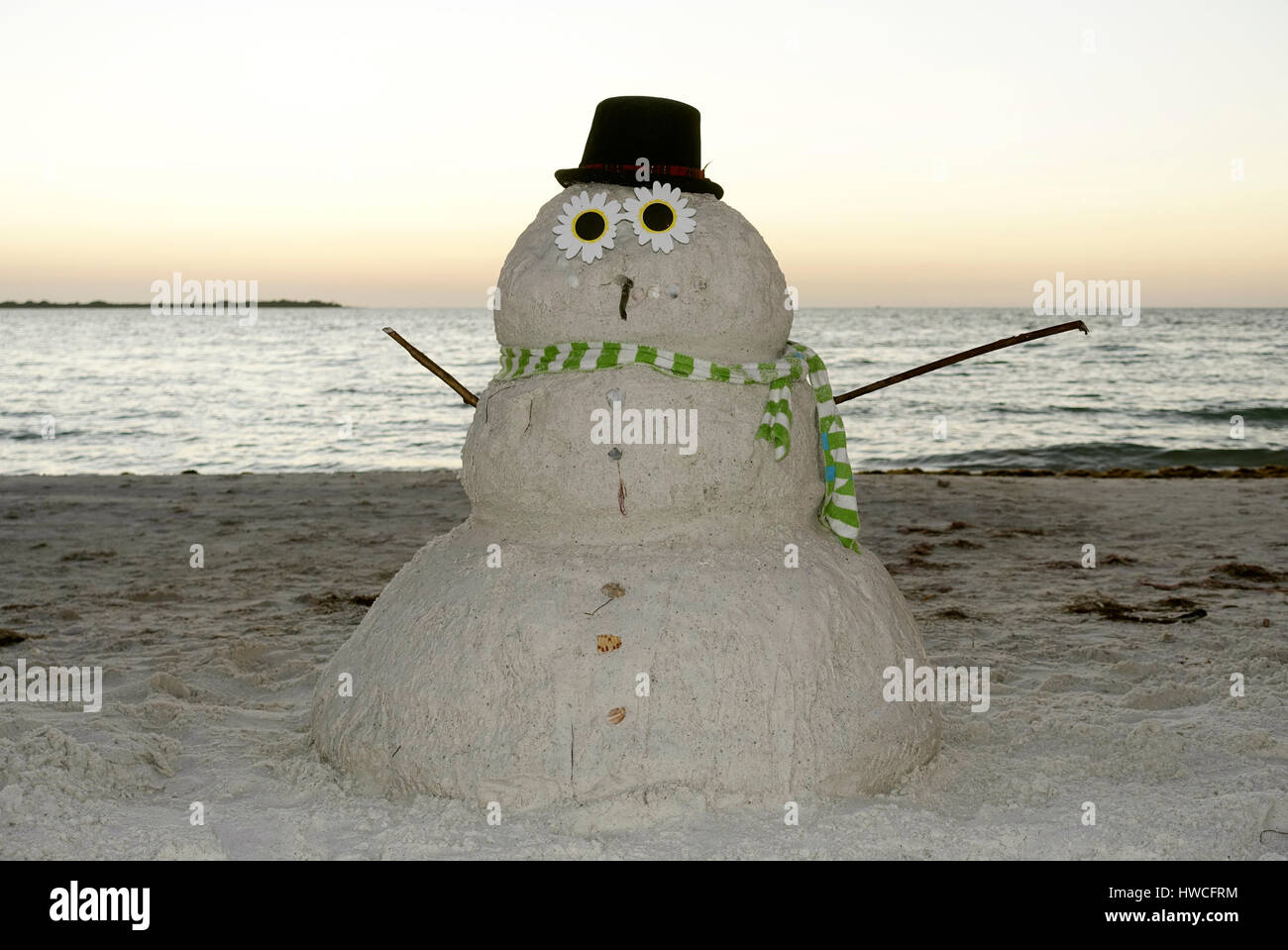 Snowman made of sand on the beach in the evening light, Fort De Soto Park, Florida, USA Stock Photo