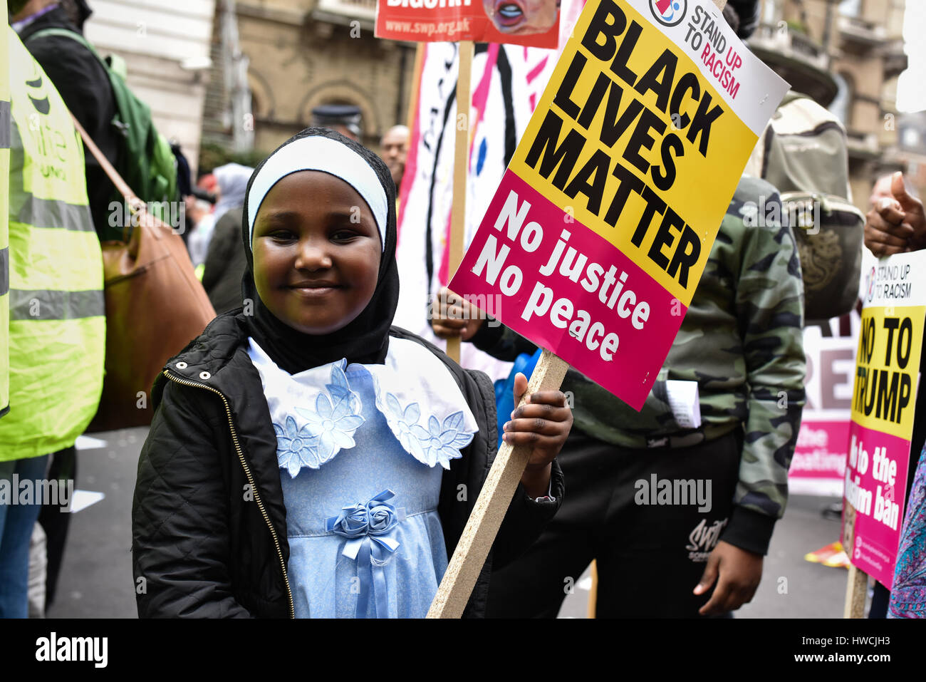 London, UK. 18th Mar, 2017. A young protester at an anti-racism demonstration in Portland Place on United Nations Anti-Racism Day, holding a sign that reads 'Black lives matter'. Hundreds of protesters marched from Portland Place to Parliament Square to oppose racism, islamophobia and anti-semitism. Credit: Jacob Sacks-Jones/Alamy Live News. Stock Photo