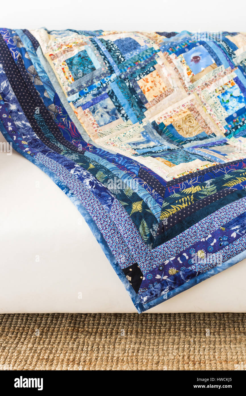 The colored patchwork quilt with blue geometry pattern. Part of