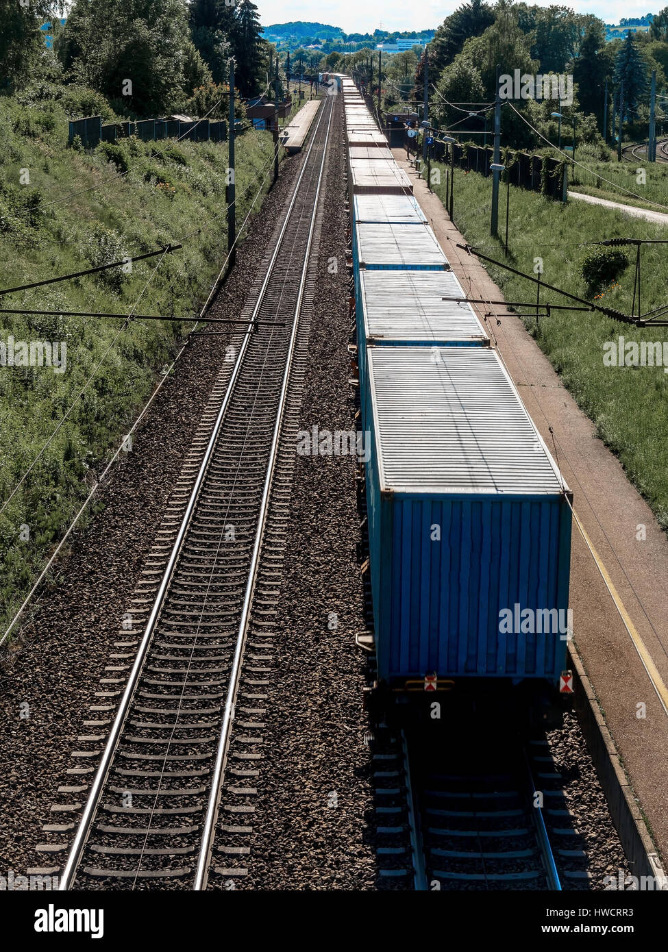 A train with goods on a section, Ein Zug mit Gütern auf einer Bahnstrecke Stock Photo