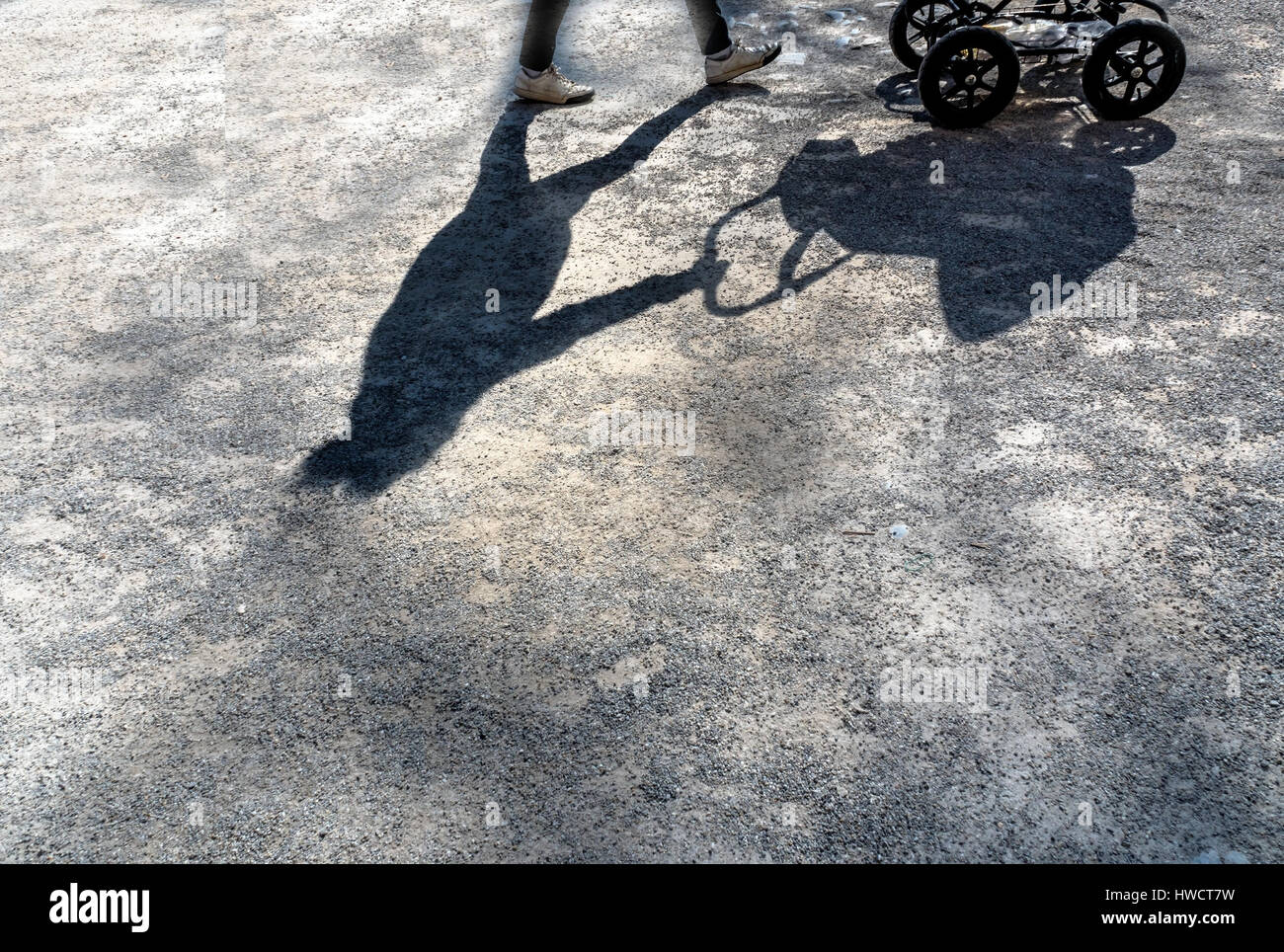 Shades eirn woman by a baby carriage. , Schatten eirn Frau mit einem Kinderwagen. Stock Photo