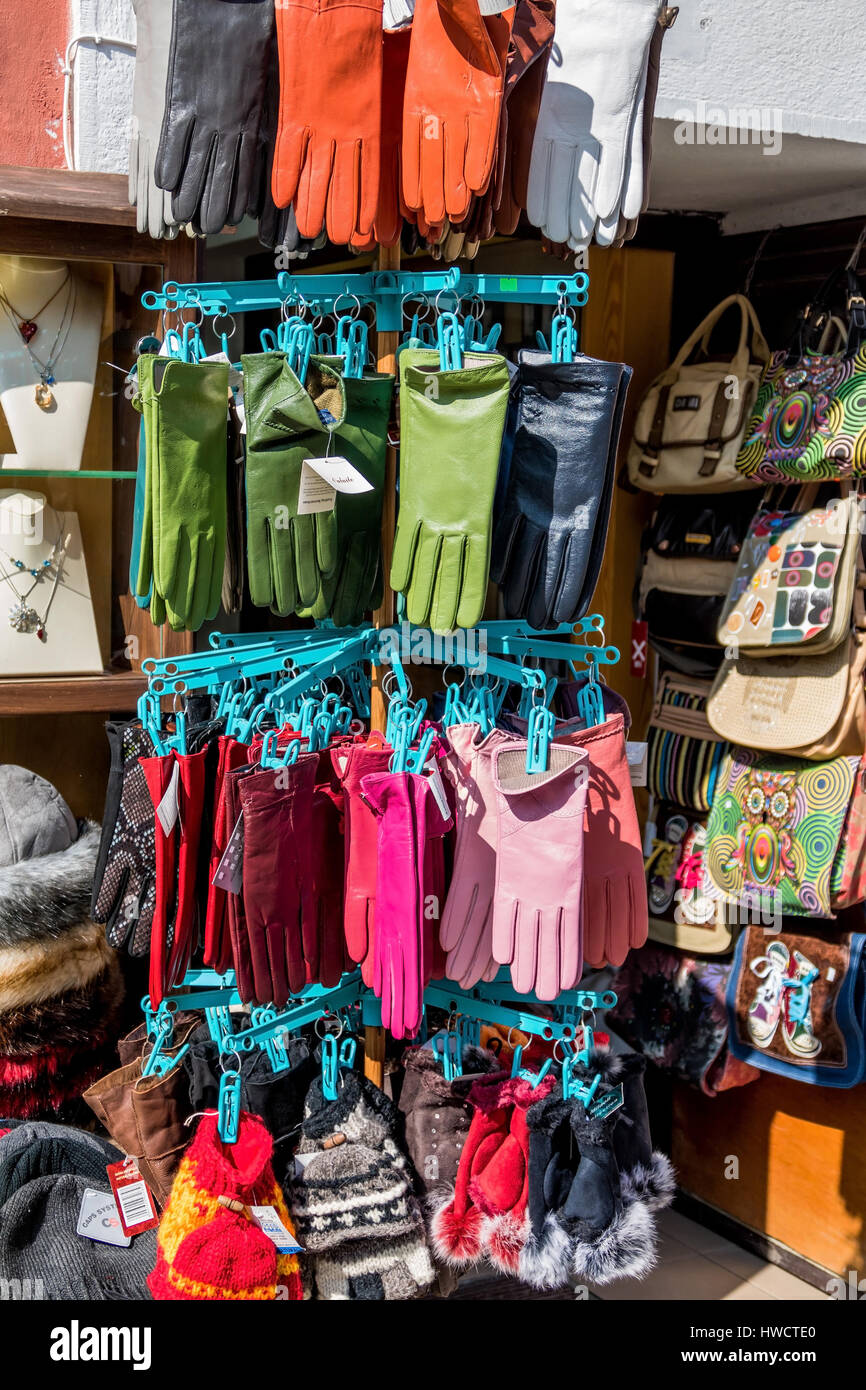 In a business coloured gloves hang for the purchase, In einem Geschäft hängen bunte Handschuhe zum Kauf Stock Photo