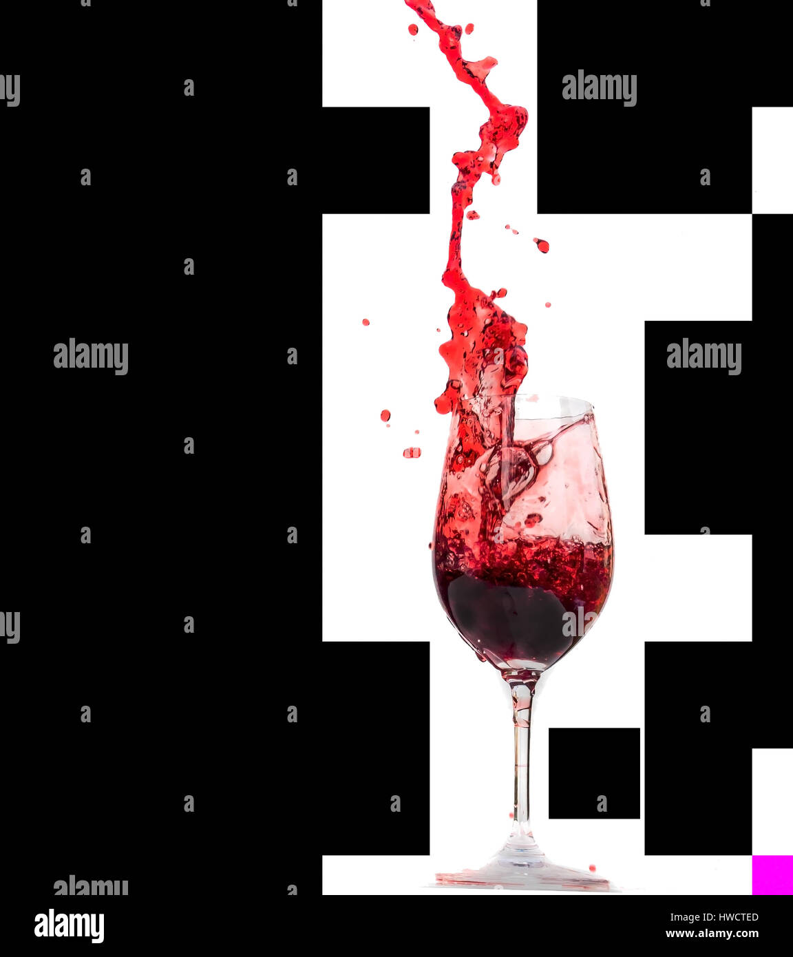 Red wine is poured from a wineglass. Wine in the red wineglass., Rotwein wird aus einem Weinglas geschüttet. Wein im Rotweinglas. Stock Photo