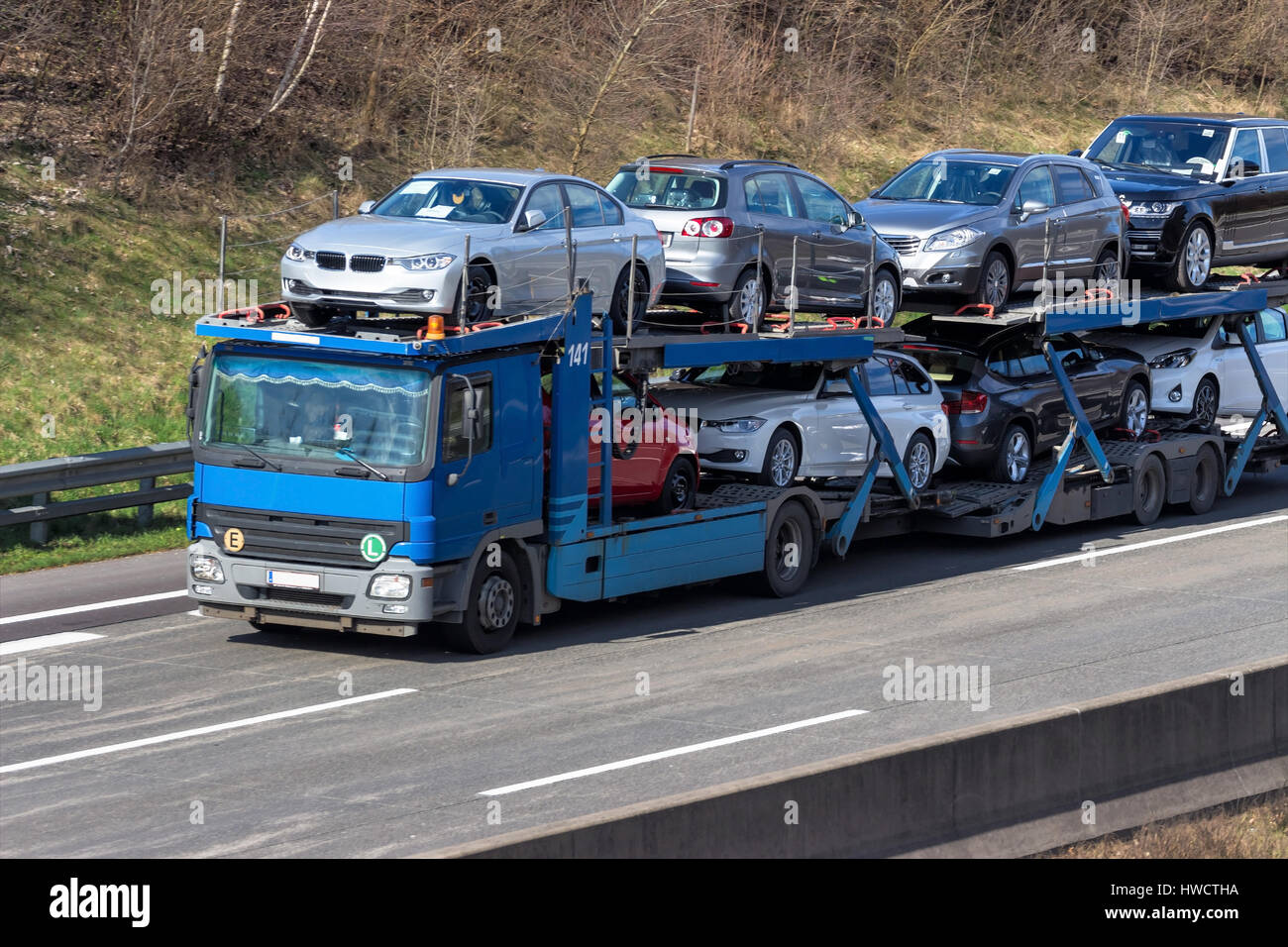 Trucks on the highway. Transport on the street for goods., Lastwagen auf der Autobahn. Transport auf der Straße für Güter. Stock Photo