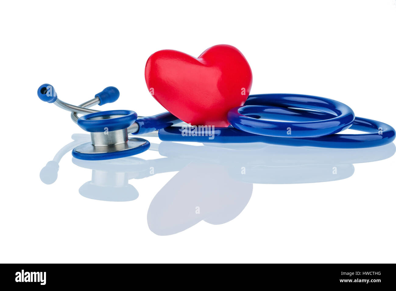 A heart and a Stethoskop lie side by side. Symbolic photo for lovesickness Ill from heart., Ein Herz und ein Stethoskop liegen nebeneinander. Symbolfo Stock Photo