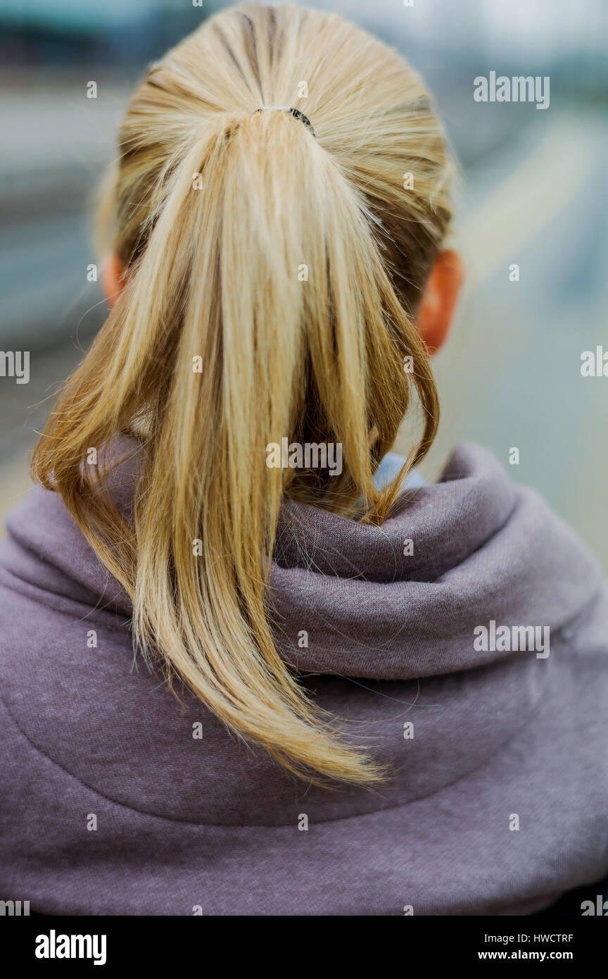 Portrait of a pensive young woman from the back, Portrait einer nachdenklichen jungen Frau von hinten Stock Photo