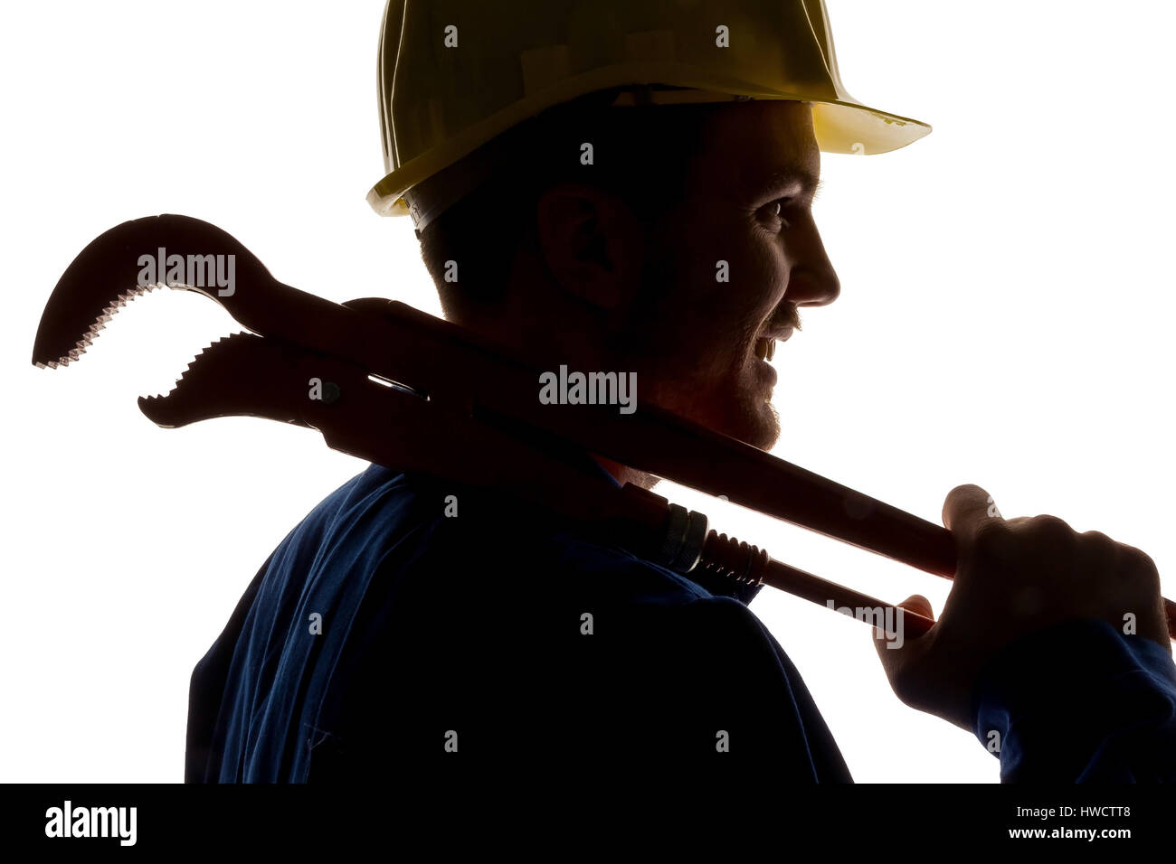 A worker in an industrial concern (craftsman) with tools in the hand, Ein Arbeiter in einem Gewerbebetrieb ( Handwerker ) mit Werkzeug in der Hand Stock Photo