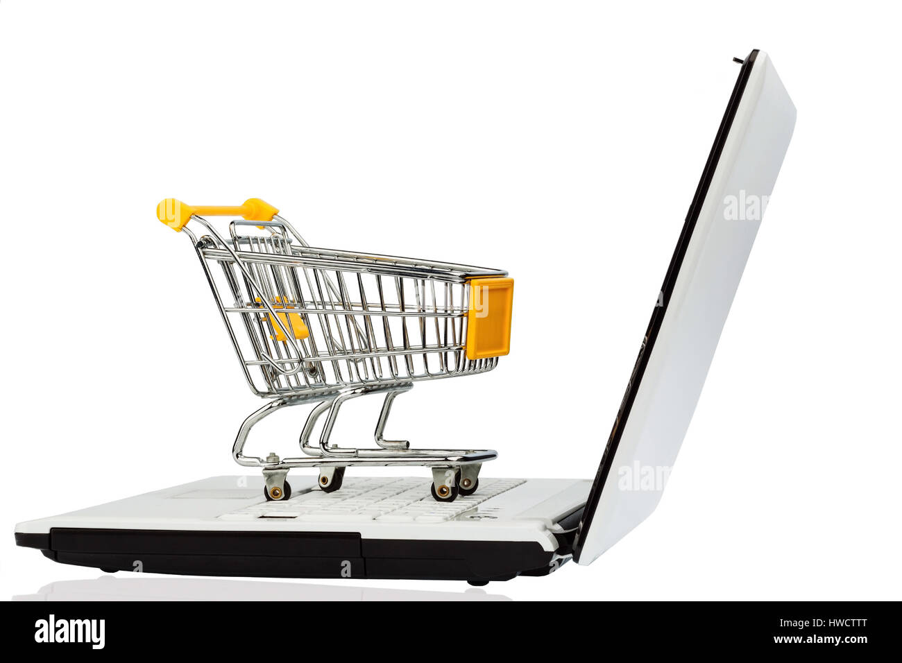 An empty shopping cart on a laptop computer. Symbolic photo for shopping on the Internet, Ein leerer Einkaufswagen auf einem Laptop Computer. Symbolfo Stock Photo