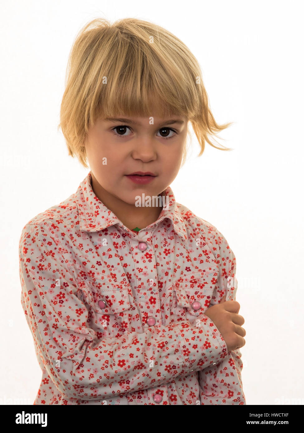 A small girl with a pensive expression, Ein kleines Mädchen mit einem nachdenklichen Gesichtsausdruck Stock Photo