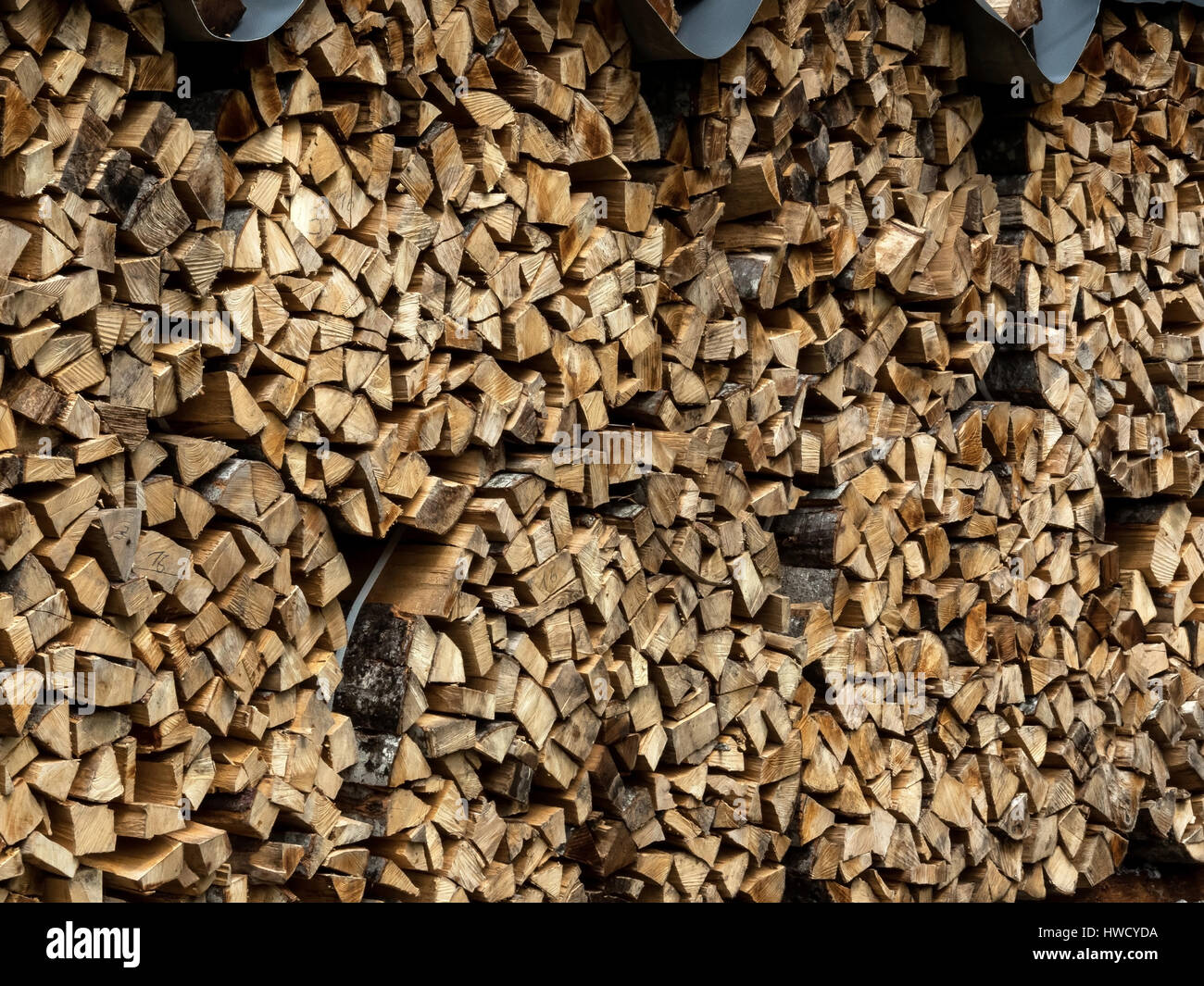 Stacked up wood as a firewood for the winter, Aufgestapeltes Holz als Brennholz für den Winter Stock Photo