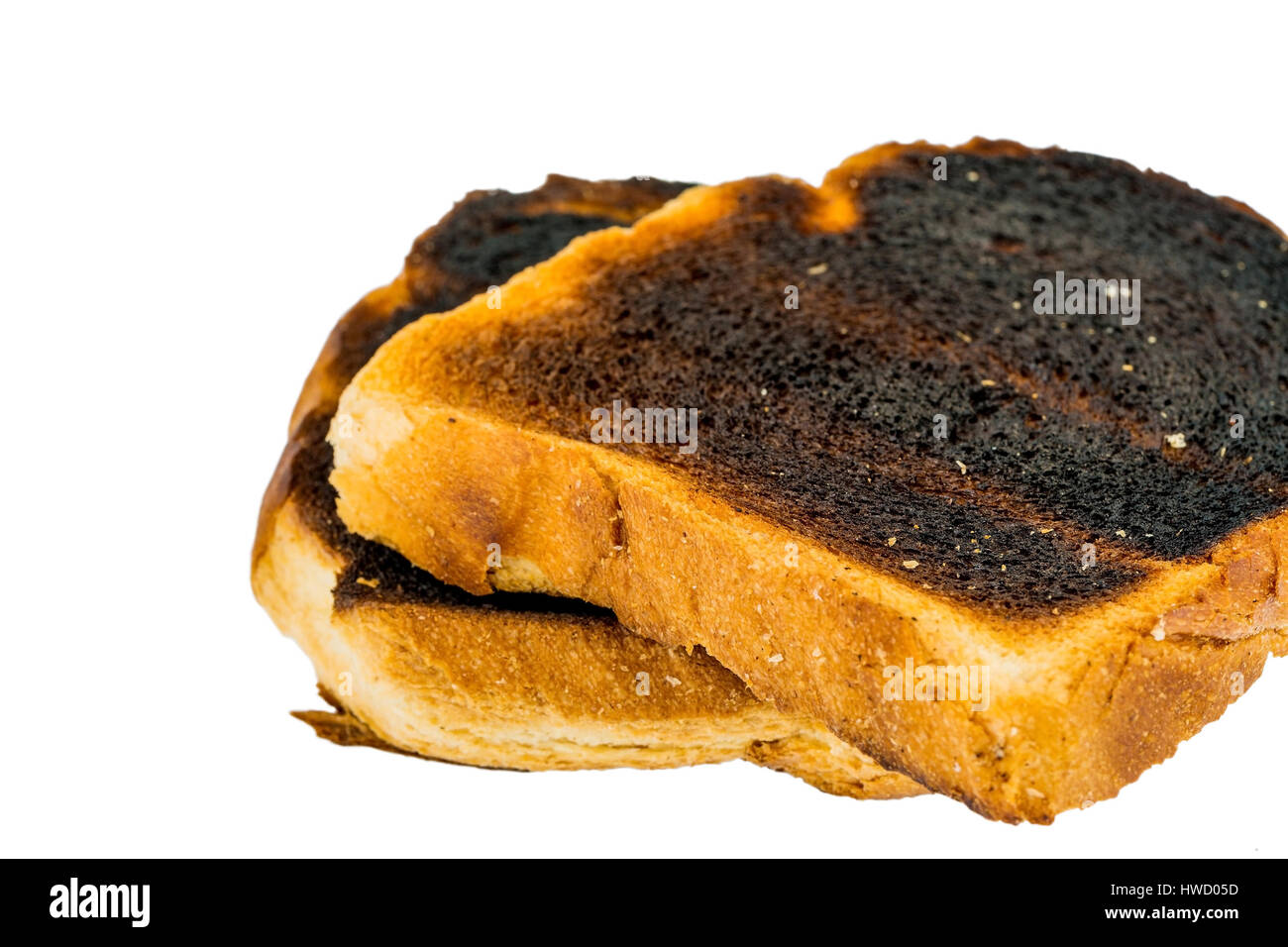 Toast bread became with drink a toast burntly. Burnt toast discs, Toastbrot wurde beim toasten verbrannt. Verbrannte Toastscheiben Stock Photo