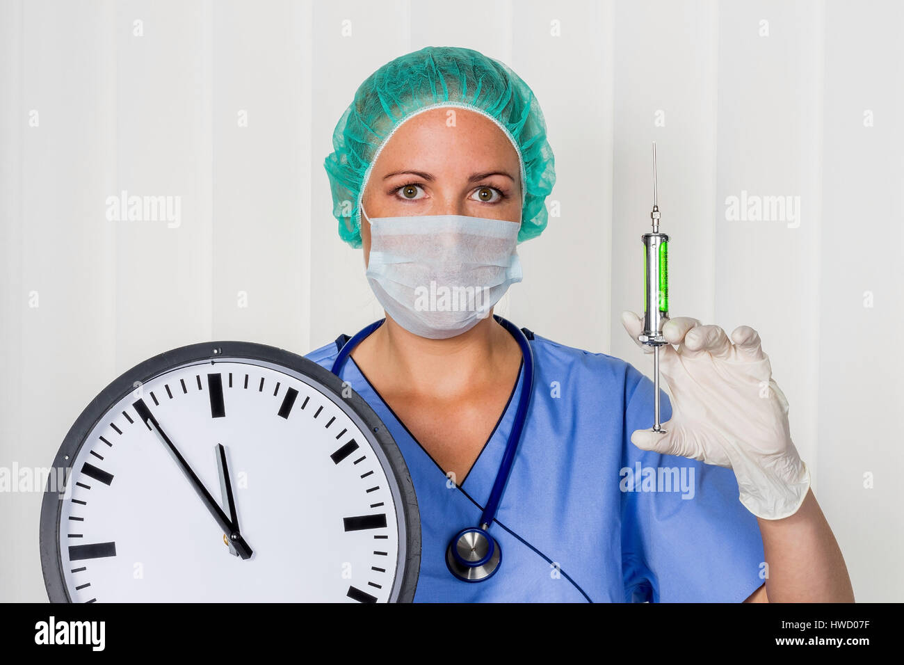 A nurse or doctor in clothes OP before an operation. Symbolic photo for stress and extra hours in the hospital., Eine Krankenschwester oder Aerztin in Stock Photo