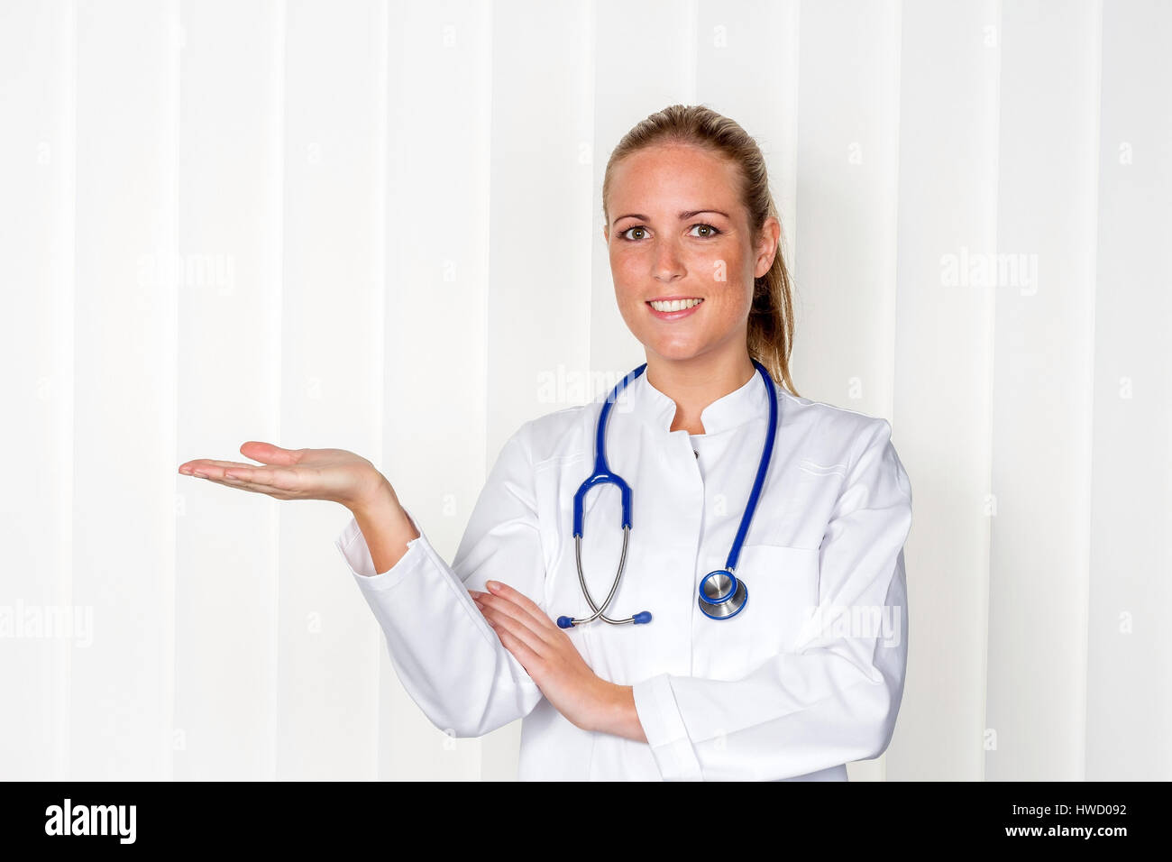 A nurse or doctor in clothes OP before an operation. Symbolic photo for stress and extra hours in the hospital., Eine Krankenschwester oder Aerztin in Stock Photo