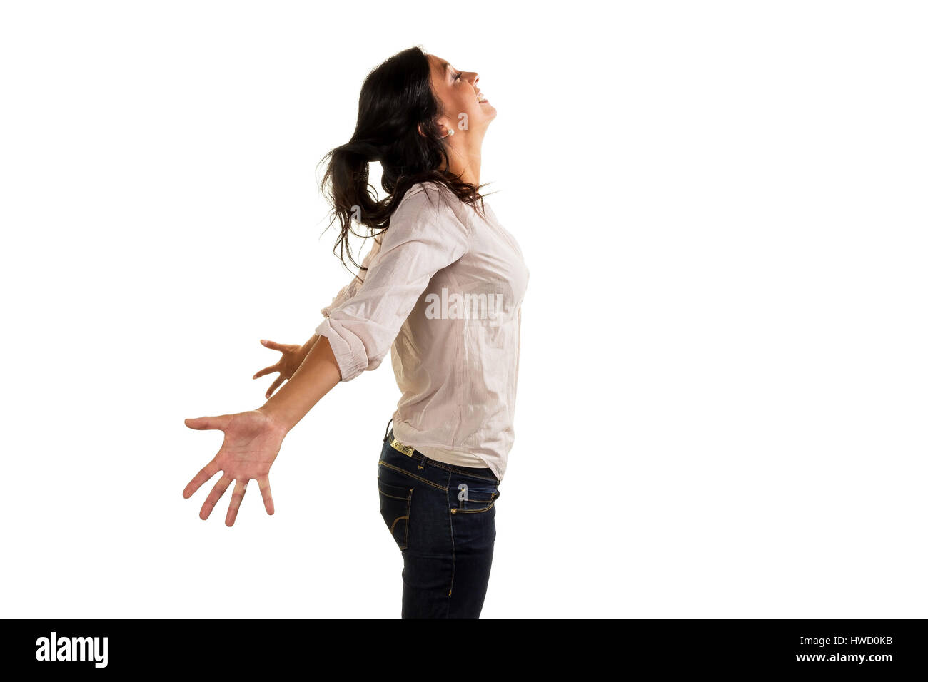 A young woman deeply breathes deeply and genius? t her life, Eine junge Frau atmet tief durch und genie?t ihr Leben Stock Photo